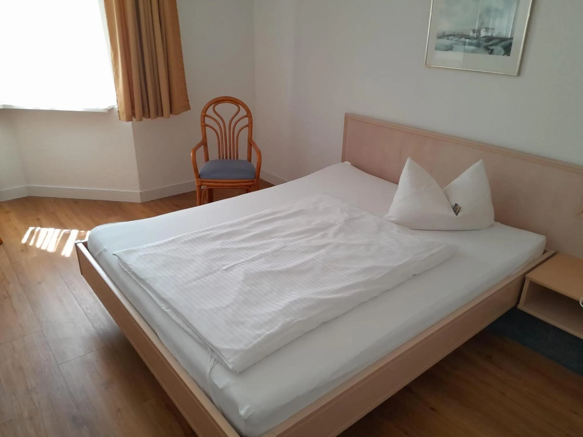 Photo of the whole room, Bed in Hotel Aichtaler Hof