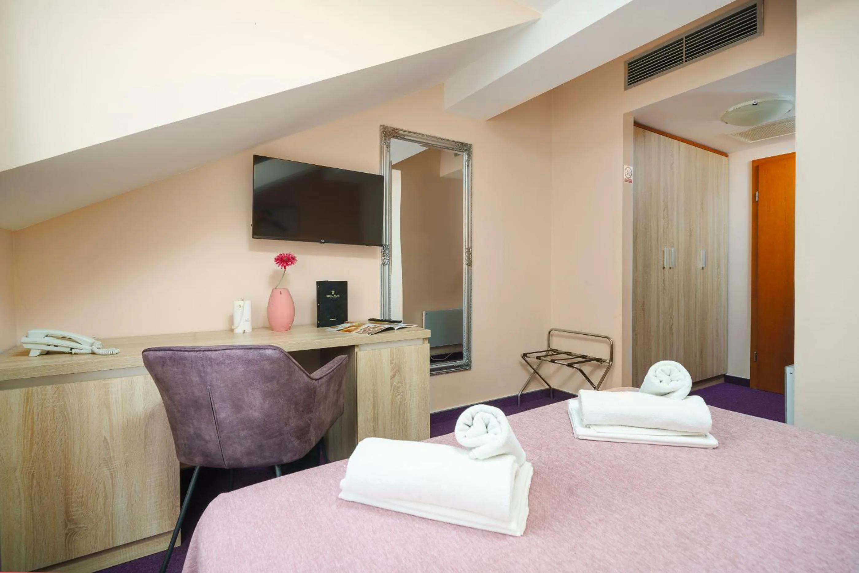 Bed in Hotel Stella Maris - Style & Comfort