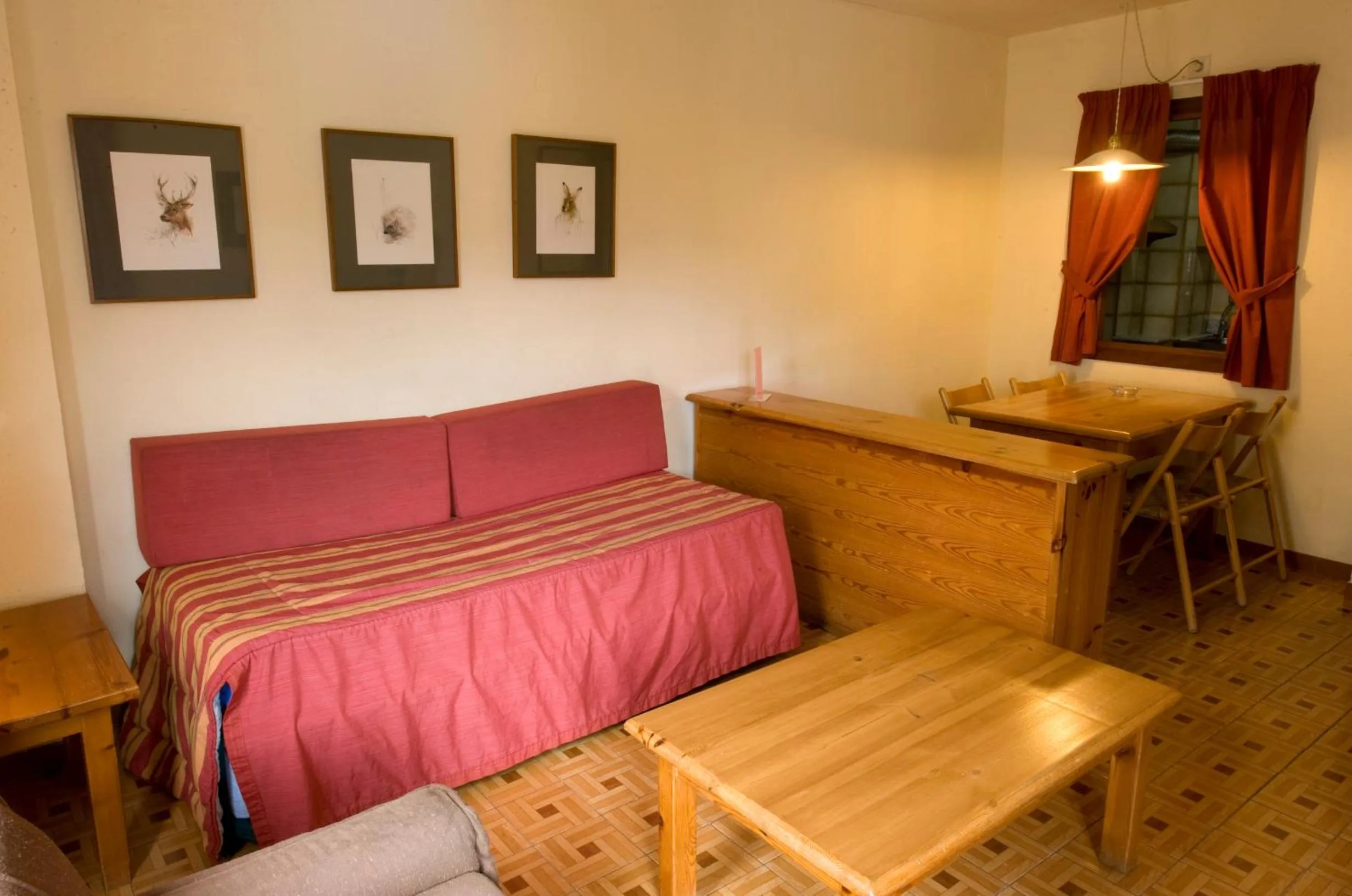 Living room, Bed in Apartamentos Pessets Adelaida