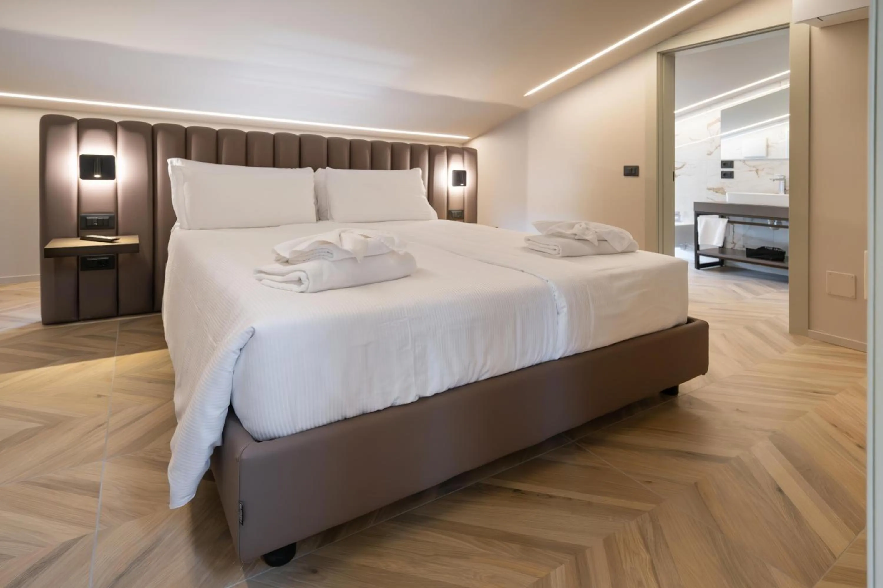 Bed in Aurora ApartHotel