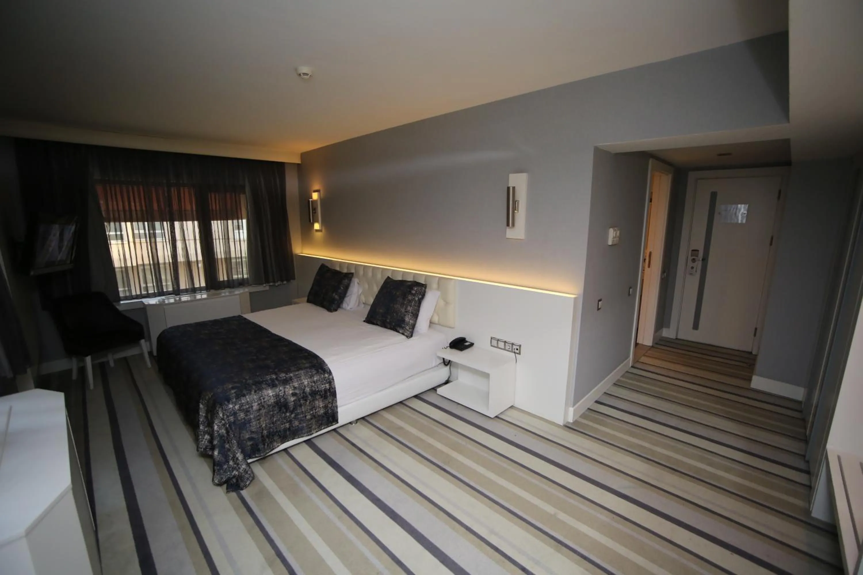 Bed in Grand Nora Hotel