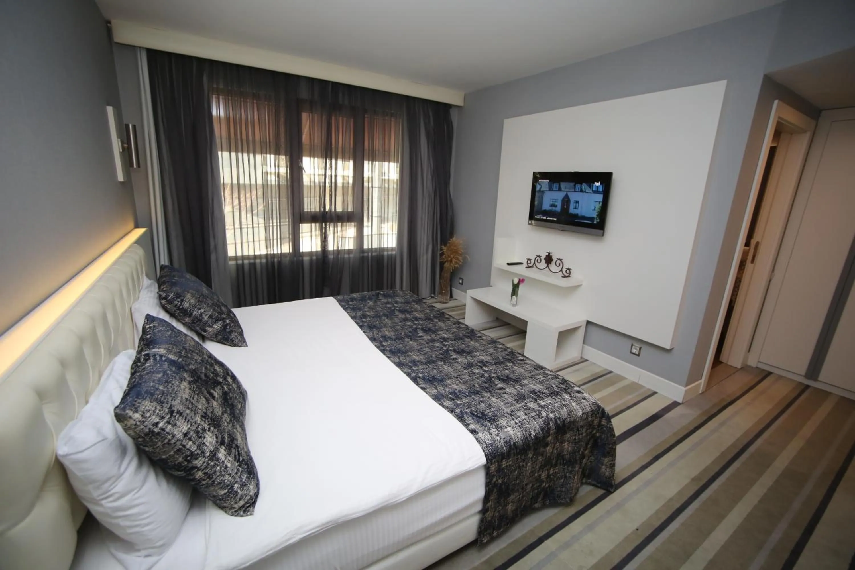 Bed in Grand Nora Hotel