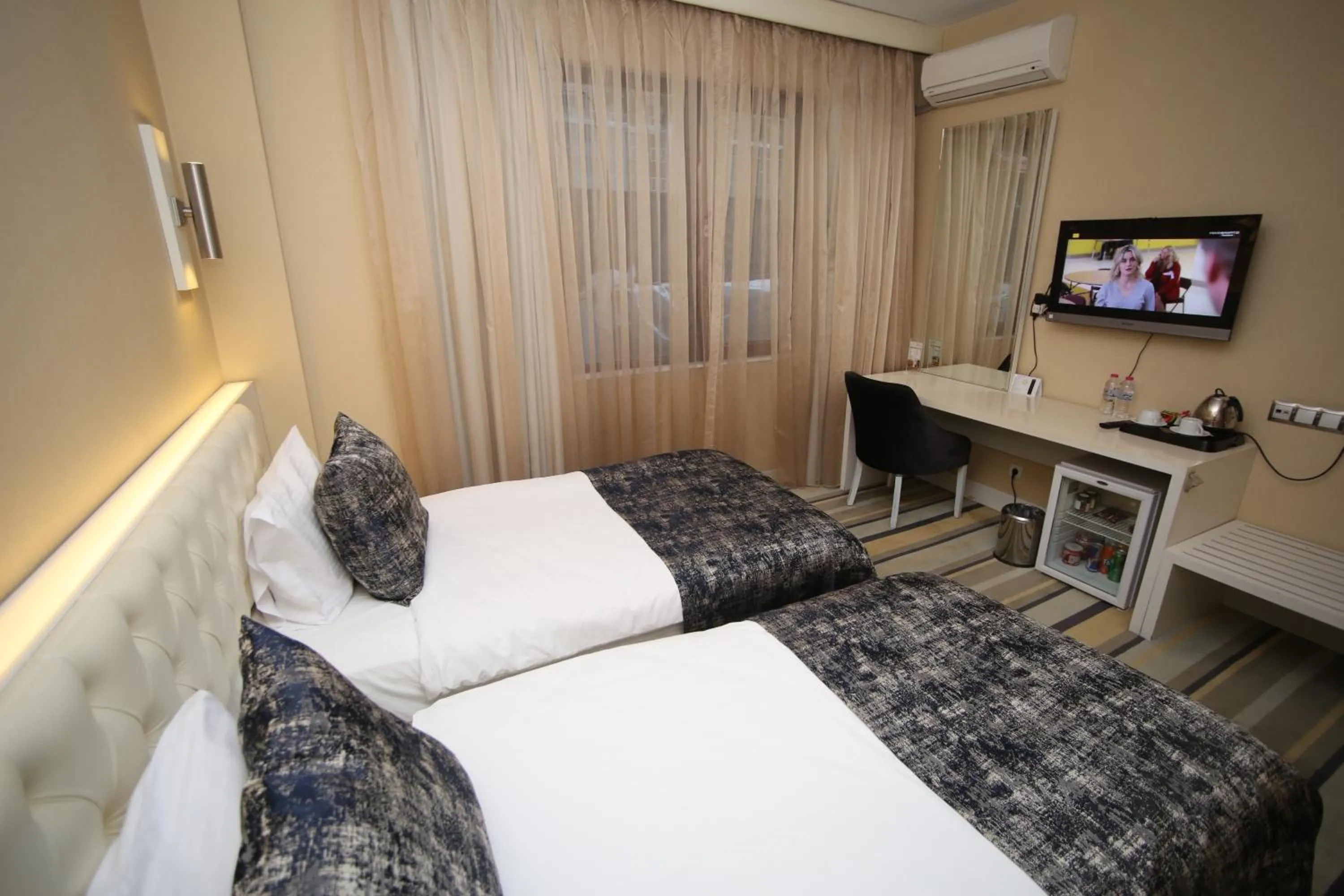 Bed in Grand Nora Hotel