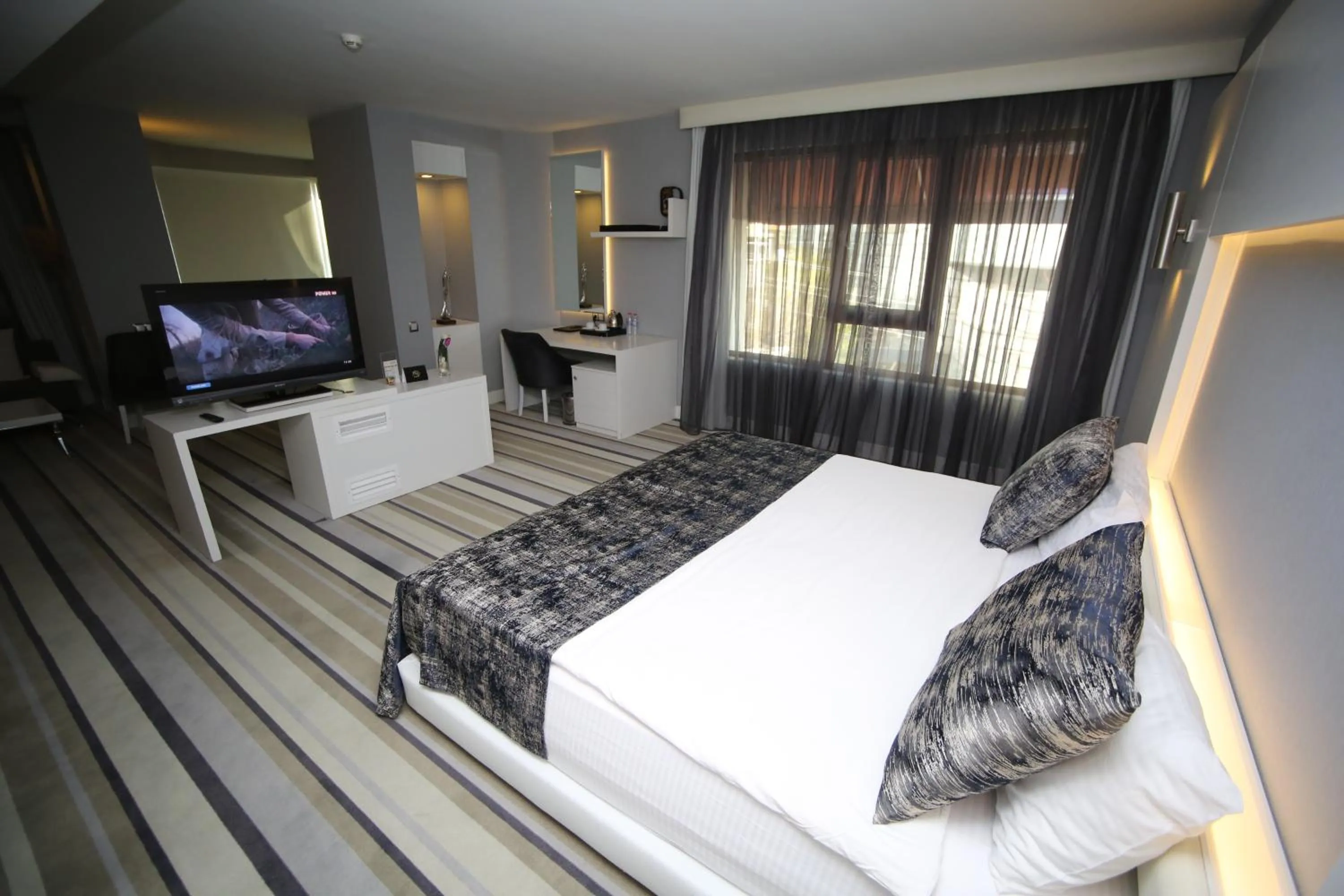 Bed in Grand Nora Hotel