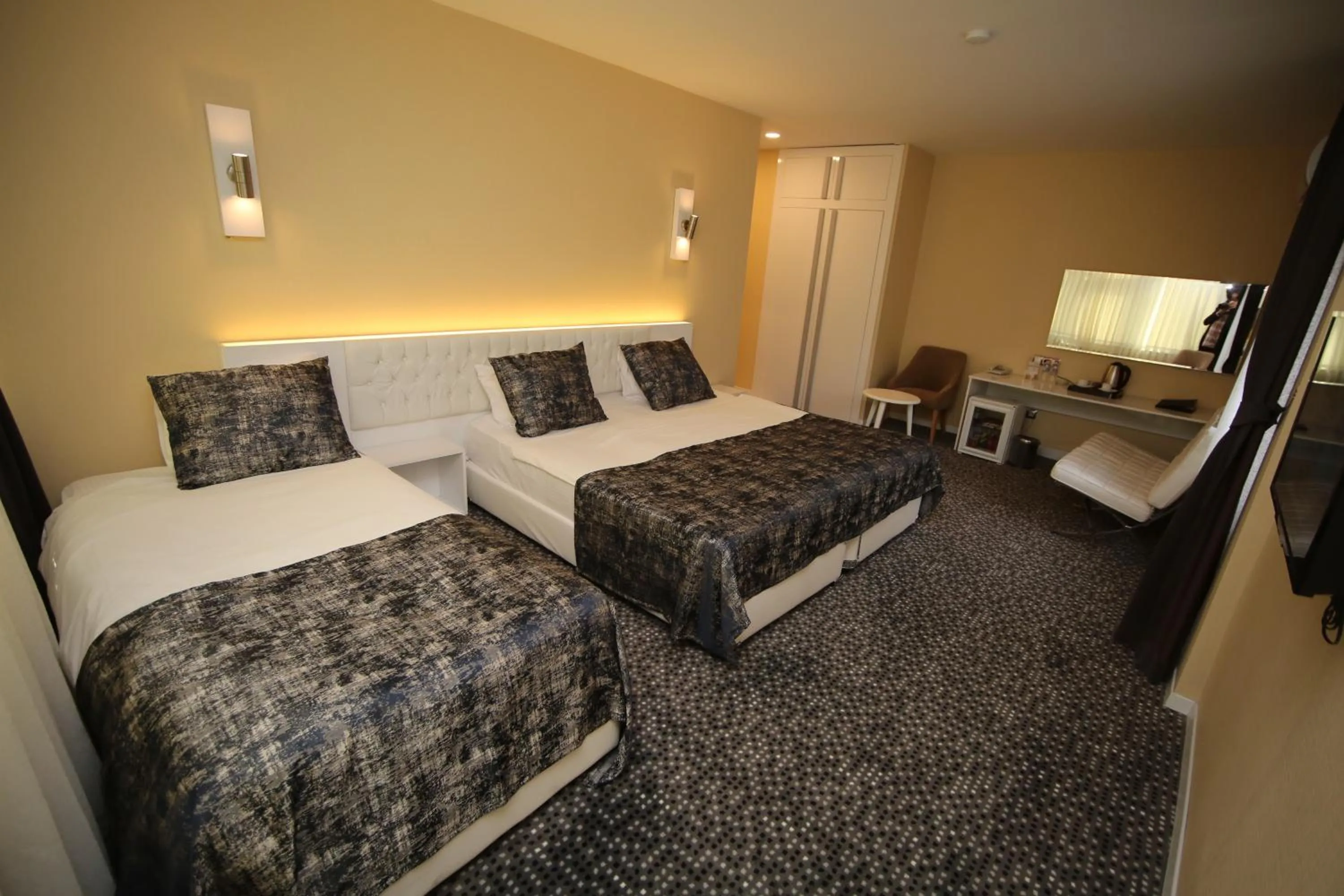 Bed in Grand Nora Hotel