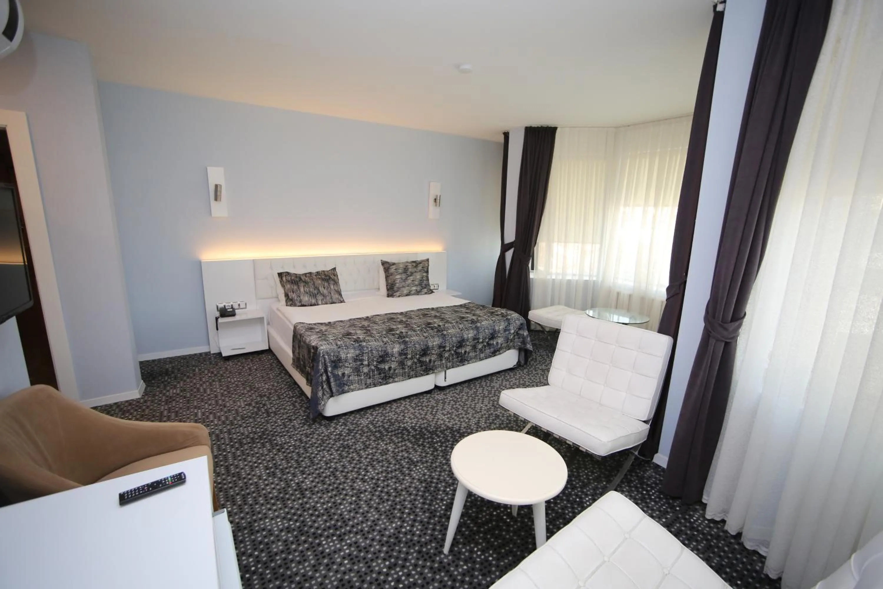 Bed in Grand Nora Hotel