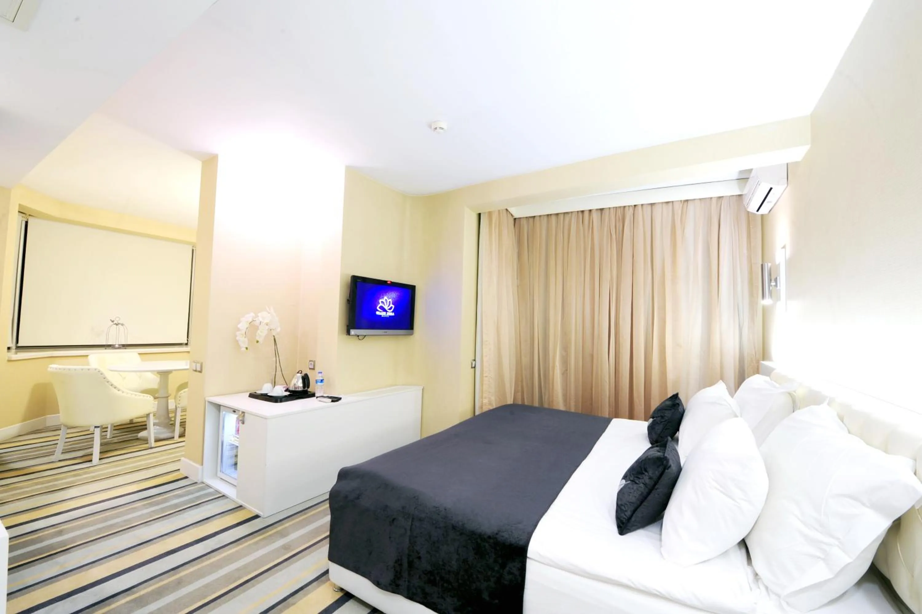 Bed in Grand Nora Hotel