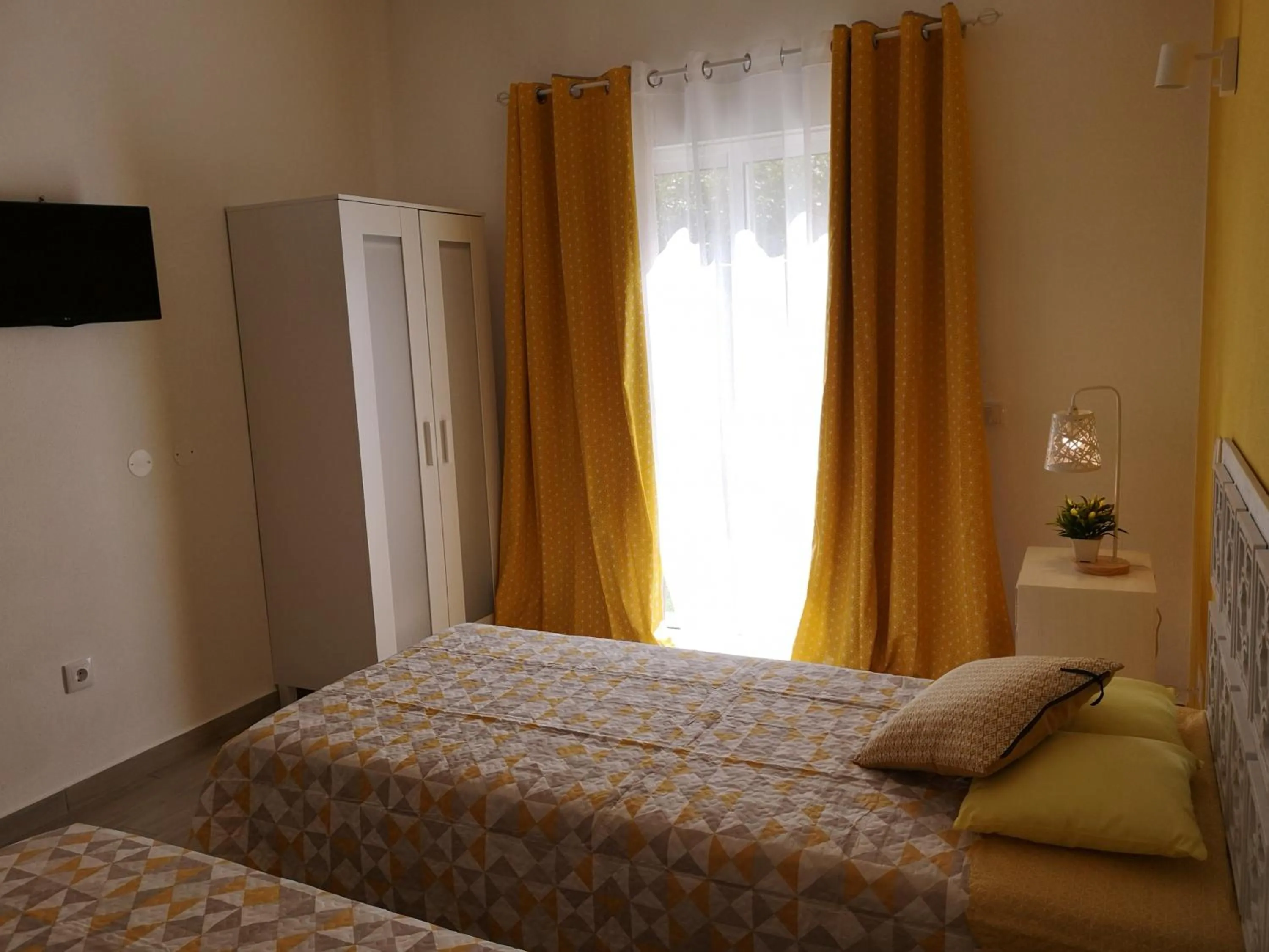 Bed in Sensations Guesthouse