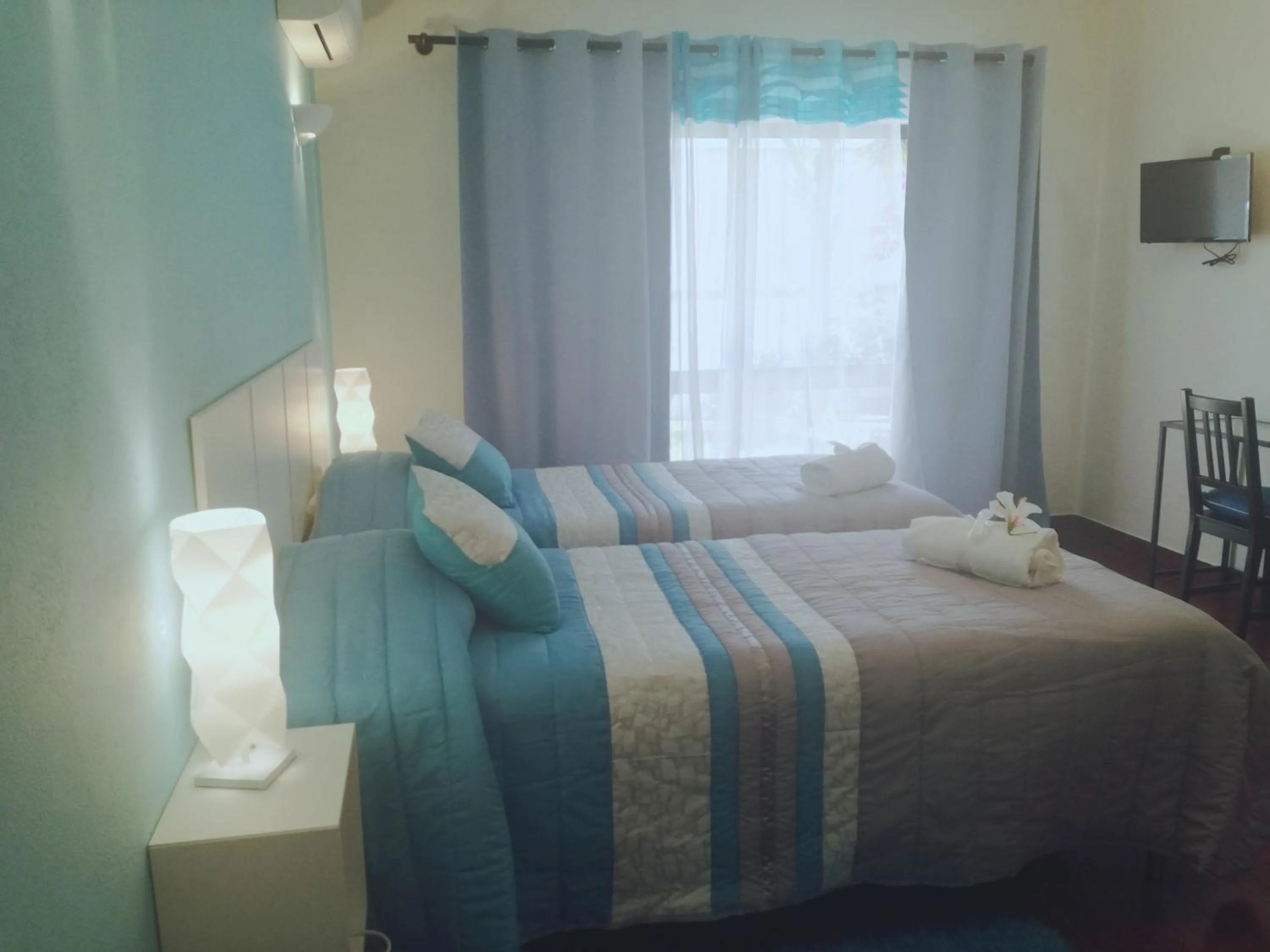 Bed in Sensations Guesthouse