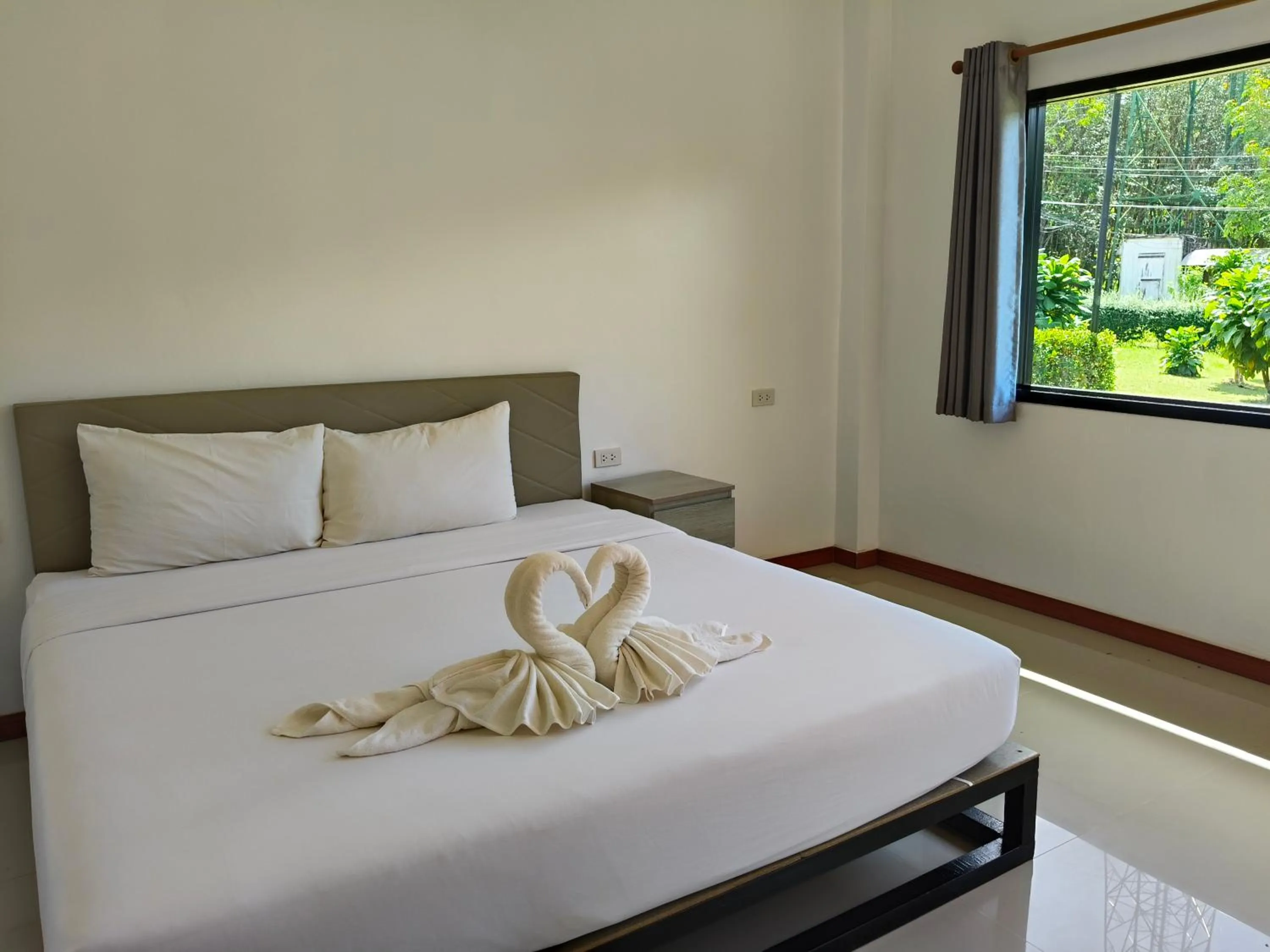 Bed in The Lodge at Koh Kood