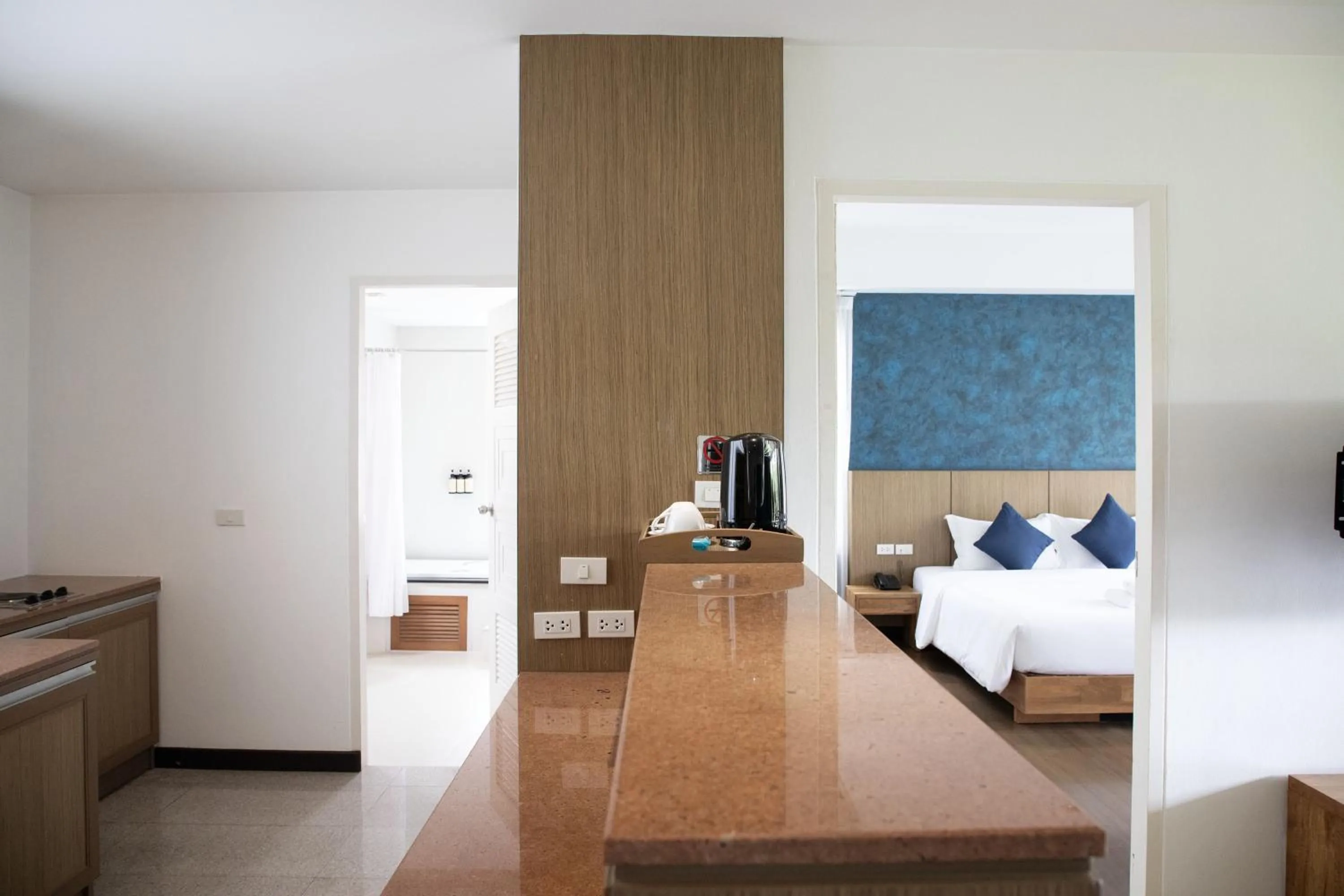 minibar, Bed in The Leela Resort & Spa Pattaya