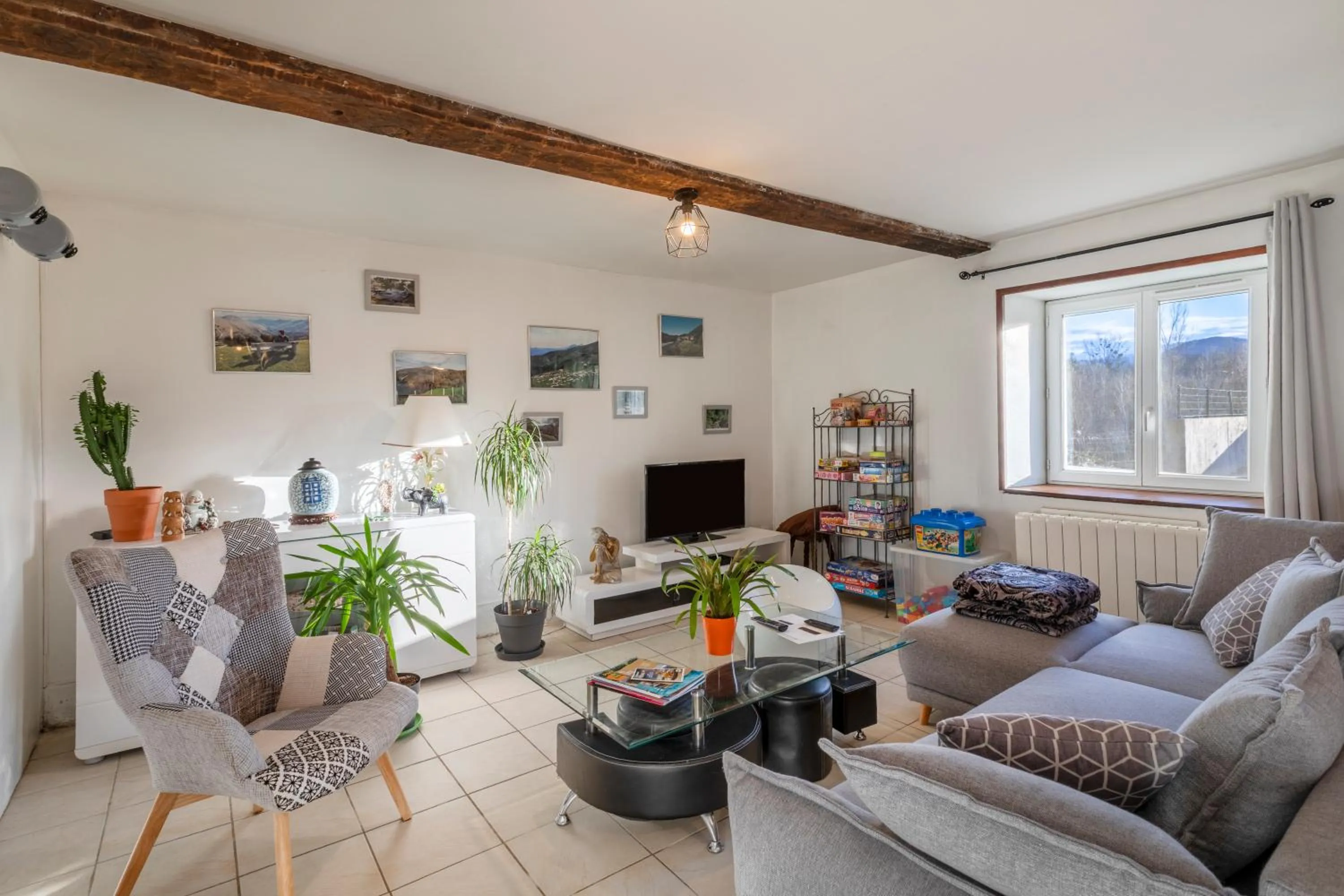 Communal lounge/ TV room in Chambres d'hôtes Chez Barbara