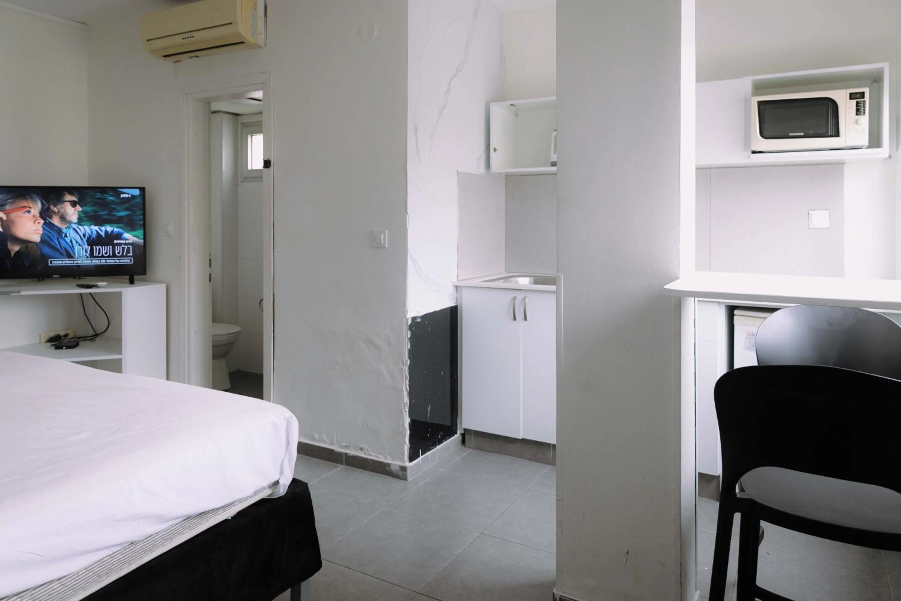 Bed in Rich Luxury Suites