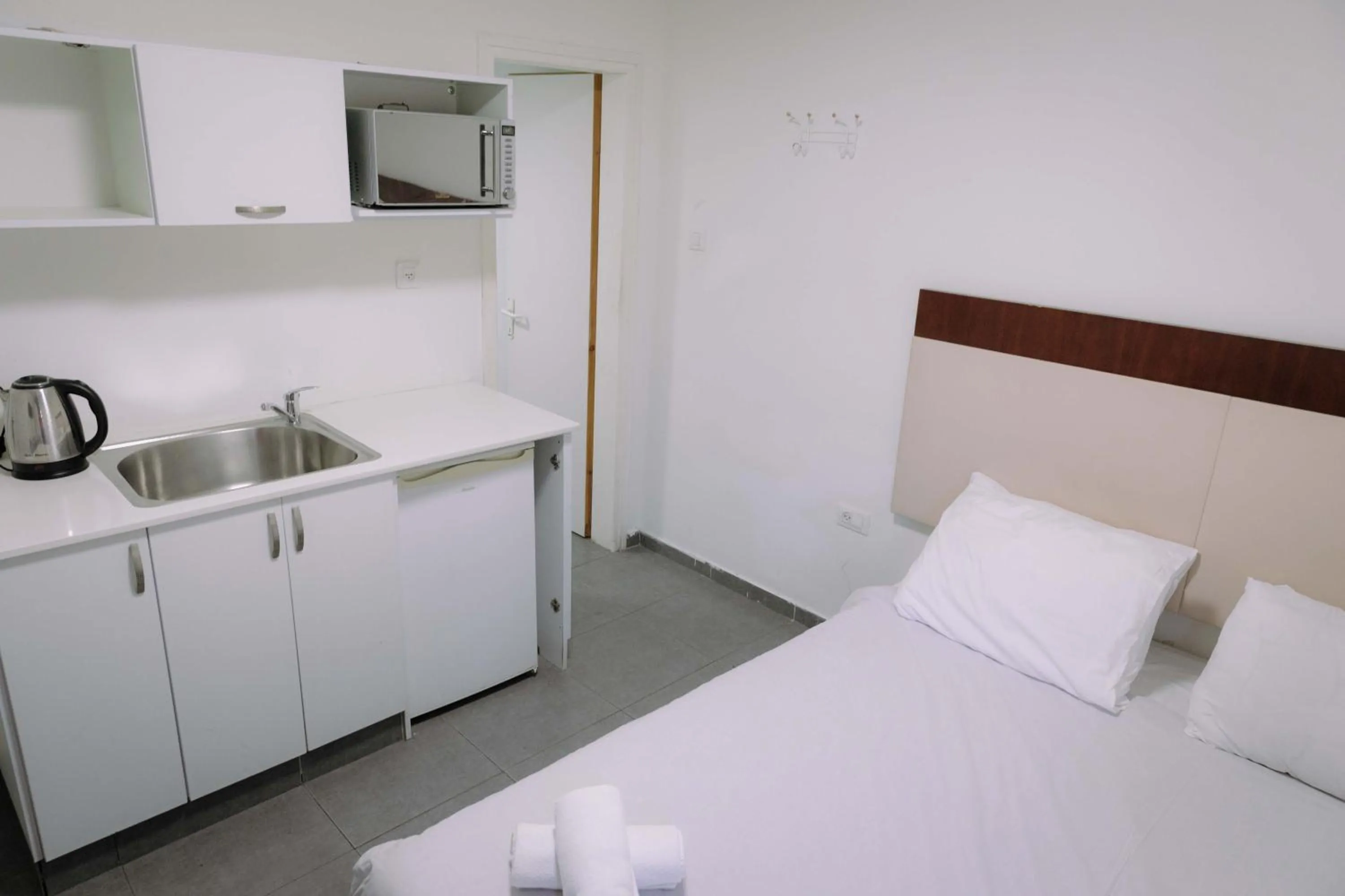 Bed in Rich Luxury Suites