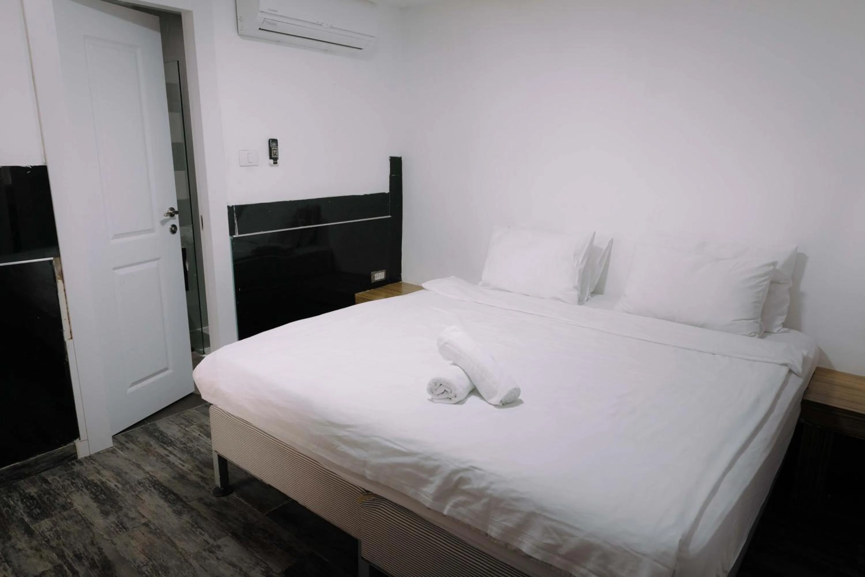 Bed in Rich Luxury Suites