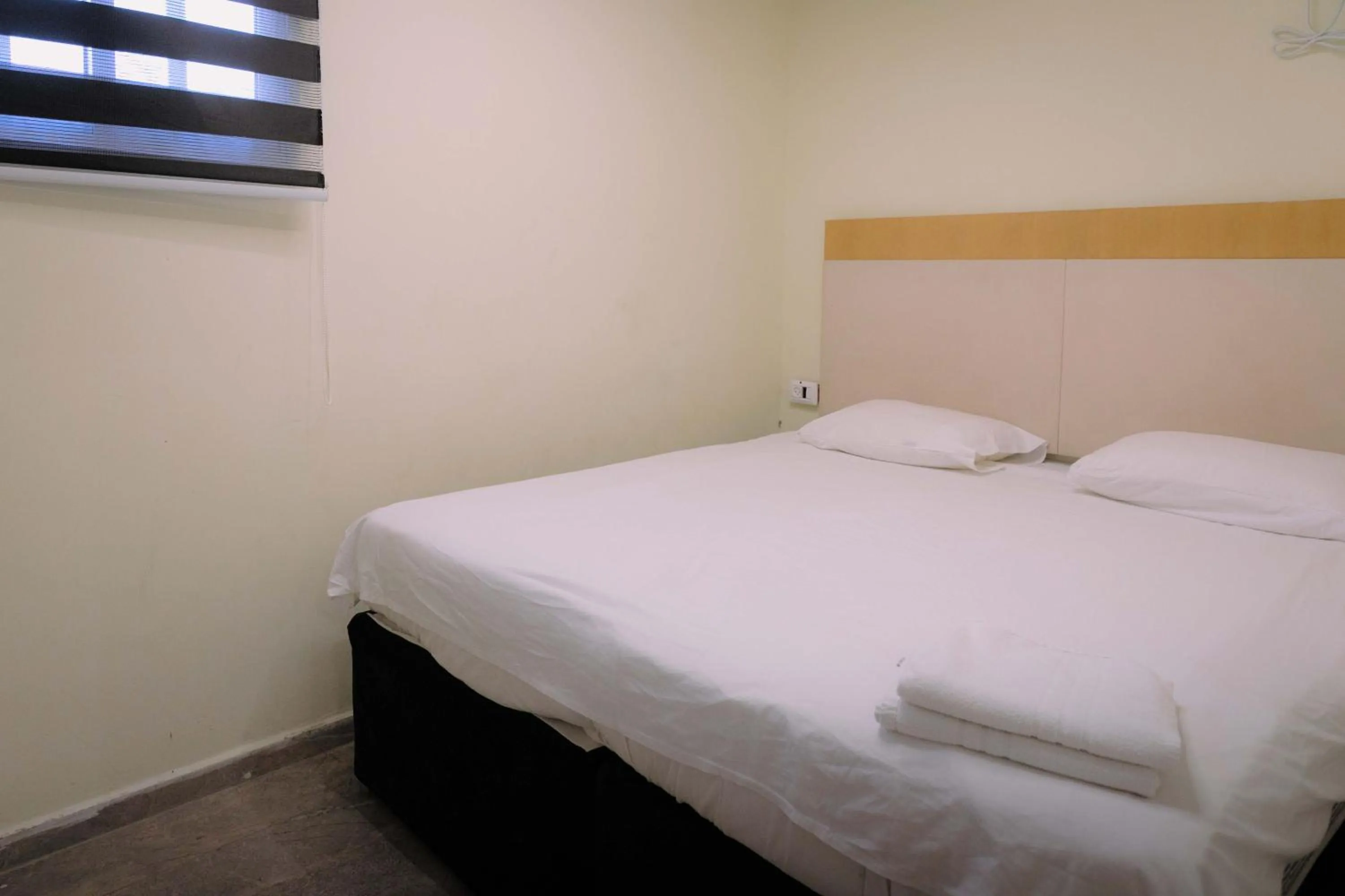 Bed in Rich Luxury Suites