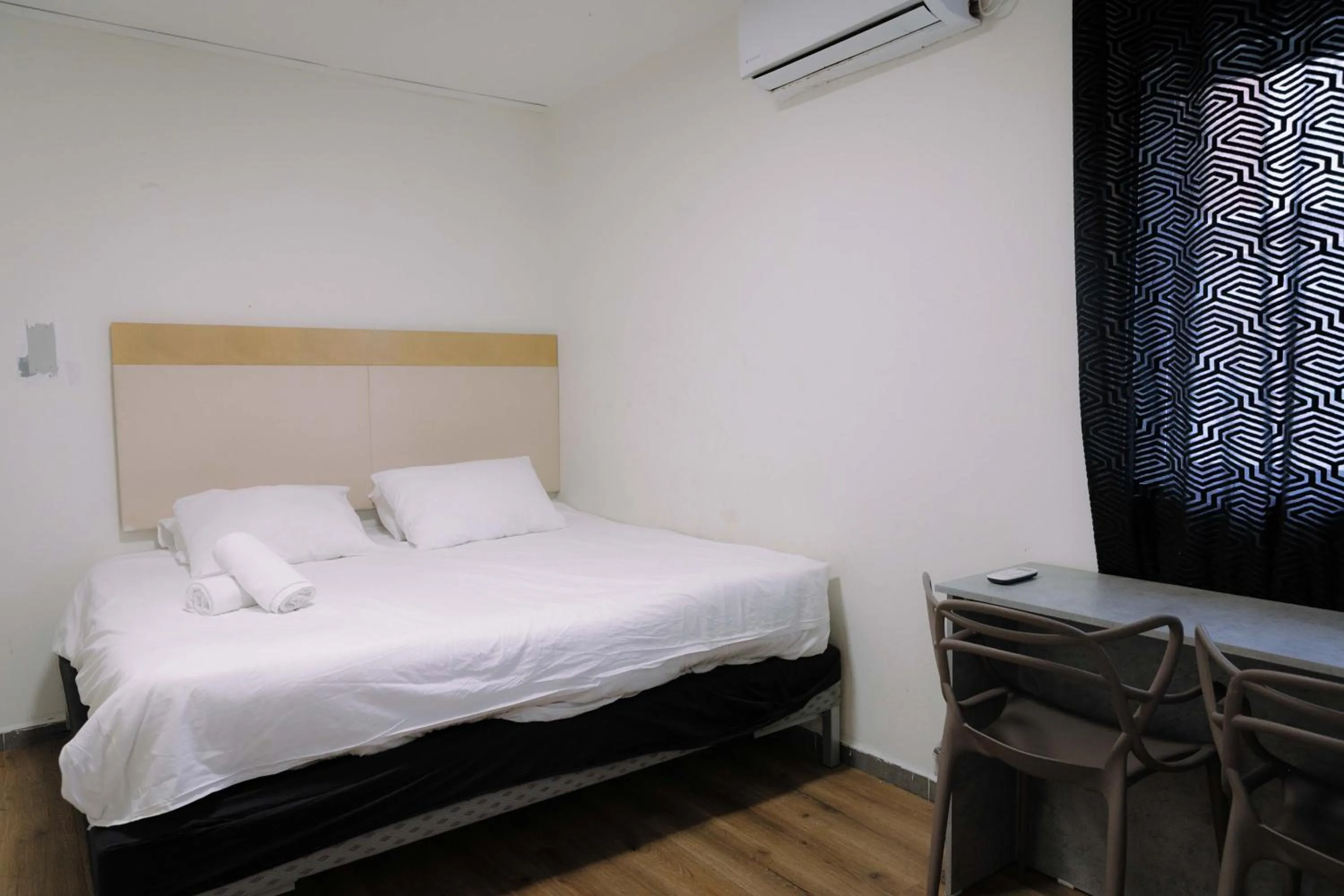 Bed in Rich Luxury Suites