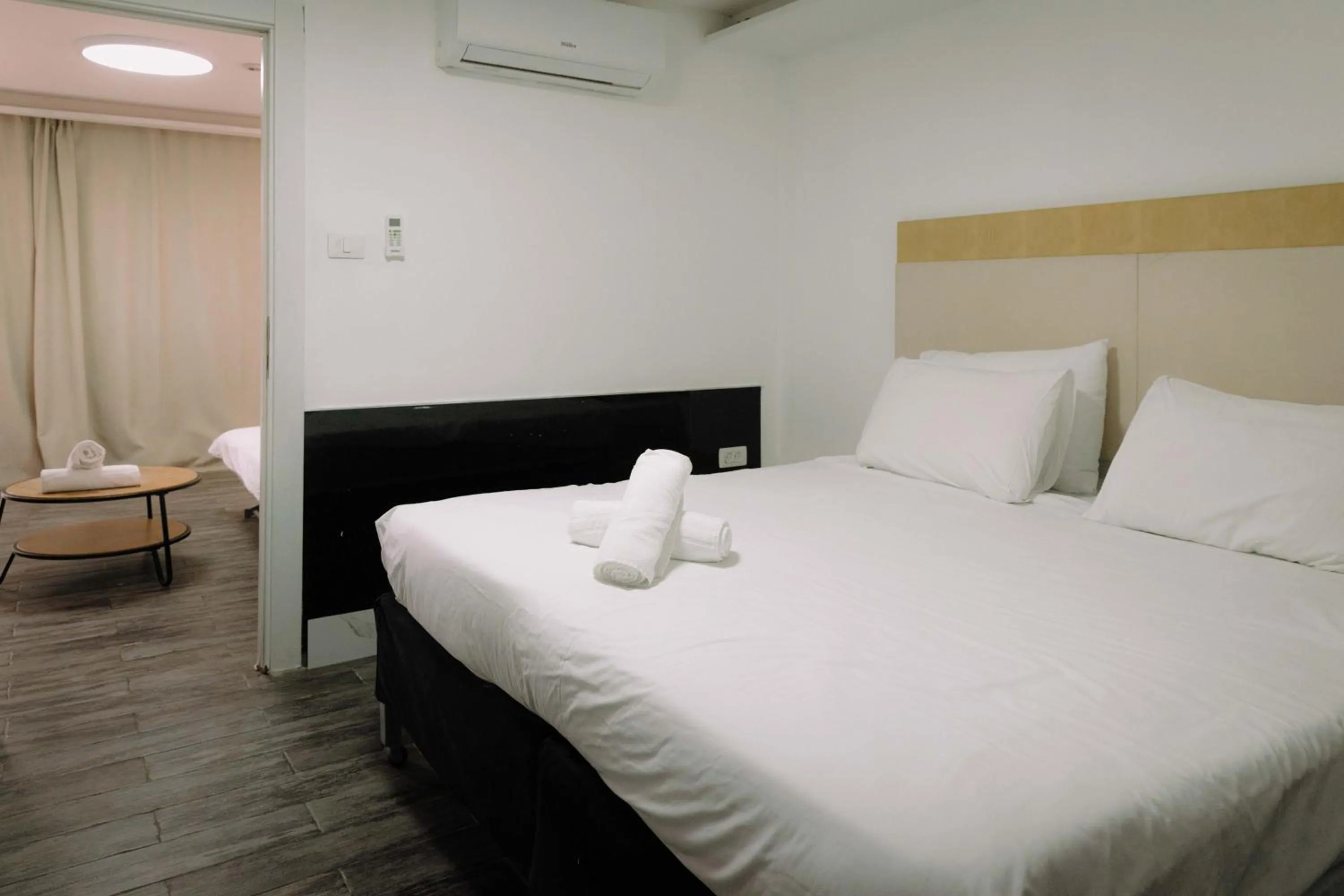 Bed in Rich Luxury Suites