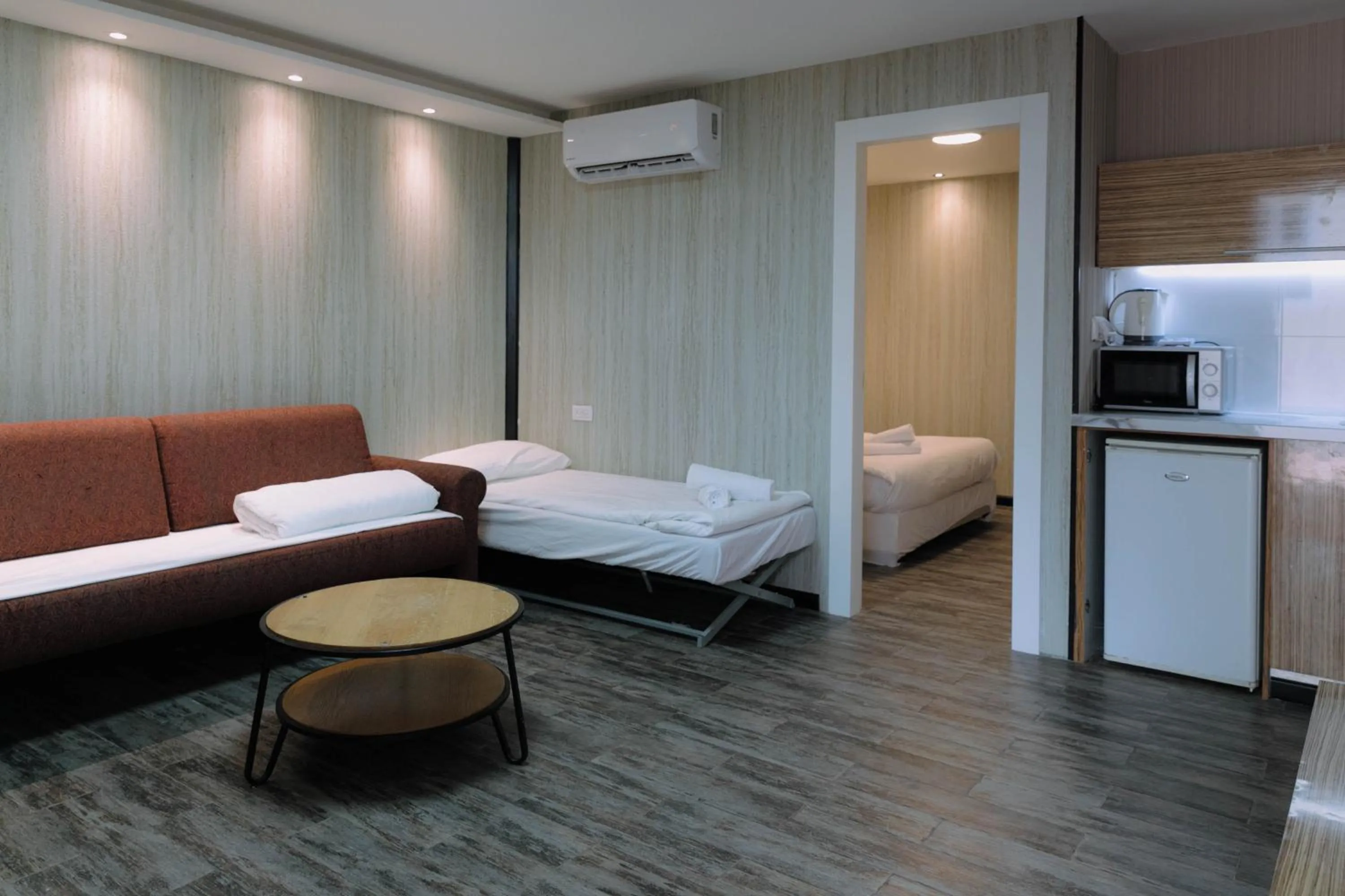 Living room, Bed in Rich Luxury Suites - Renovated