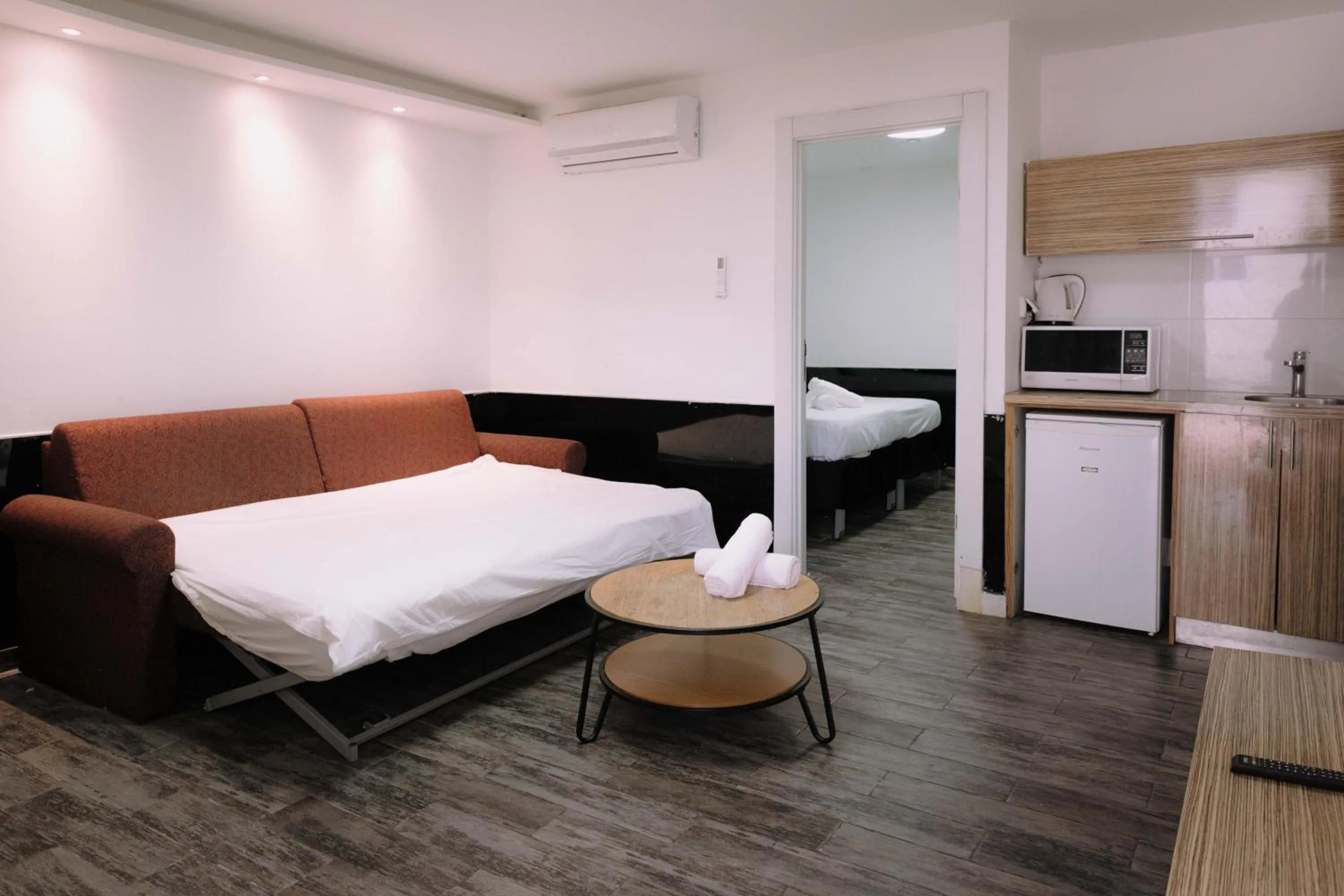 Bed in Rich Luxury Suites