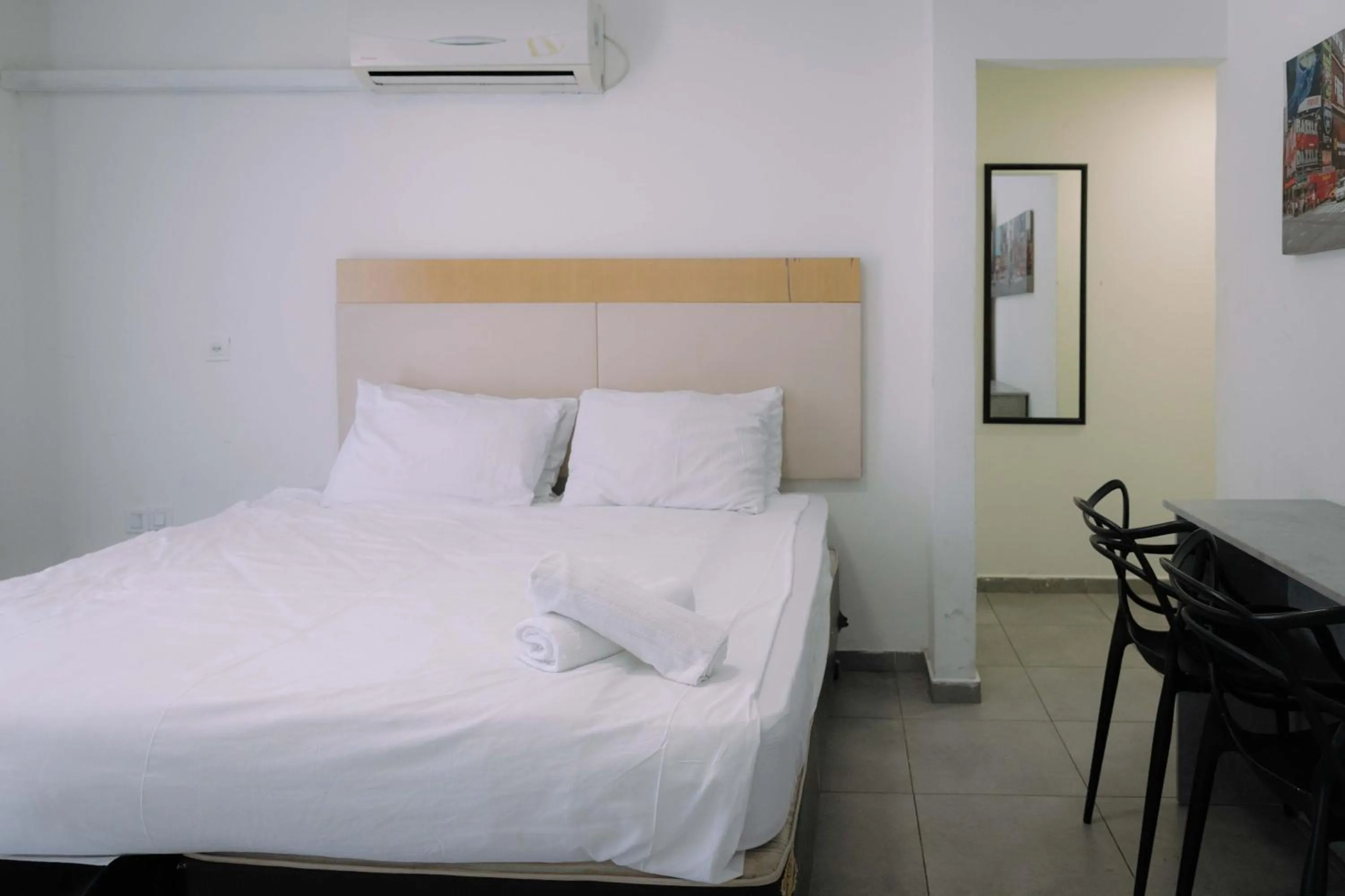 Bed in Rich Luxury Suites