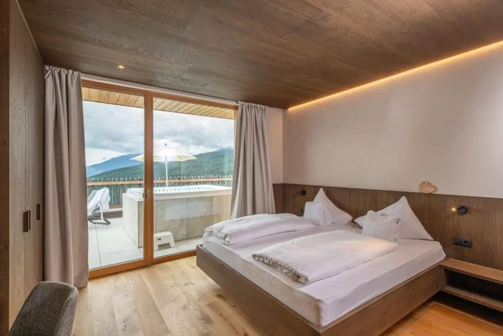 Bed in Tratterhof Mountain Sky Hotel