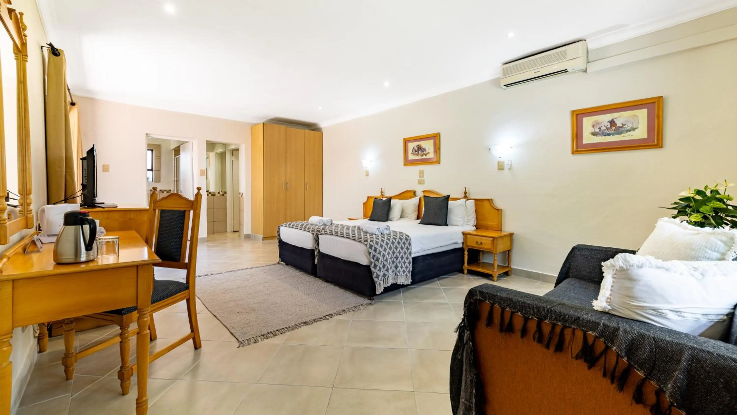 Bed in Hotel Numbi & Garden Suites