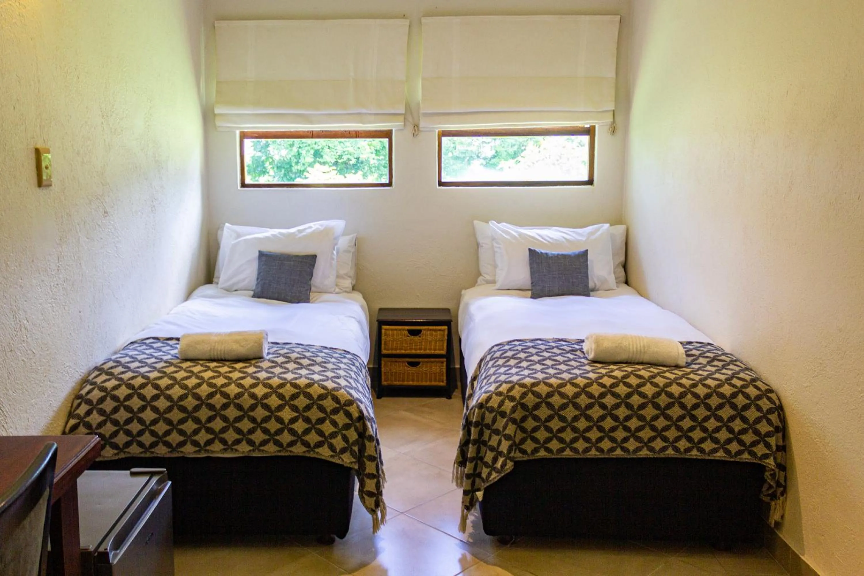 Bed in Hotel Numbi & Garden Suites