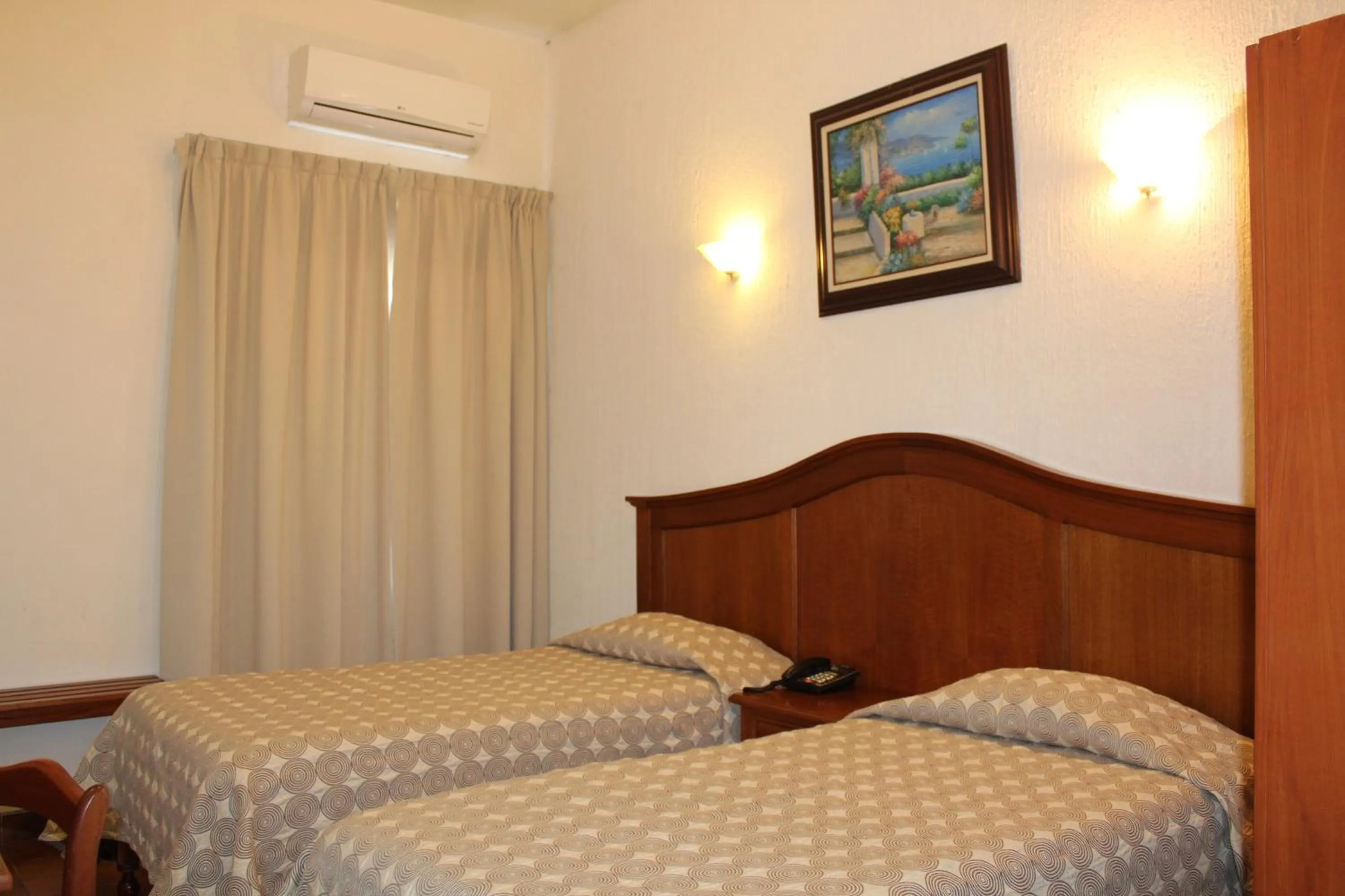 Bed in Hotel Posada Doña Lala