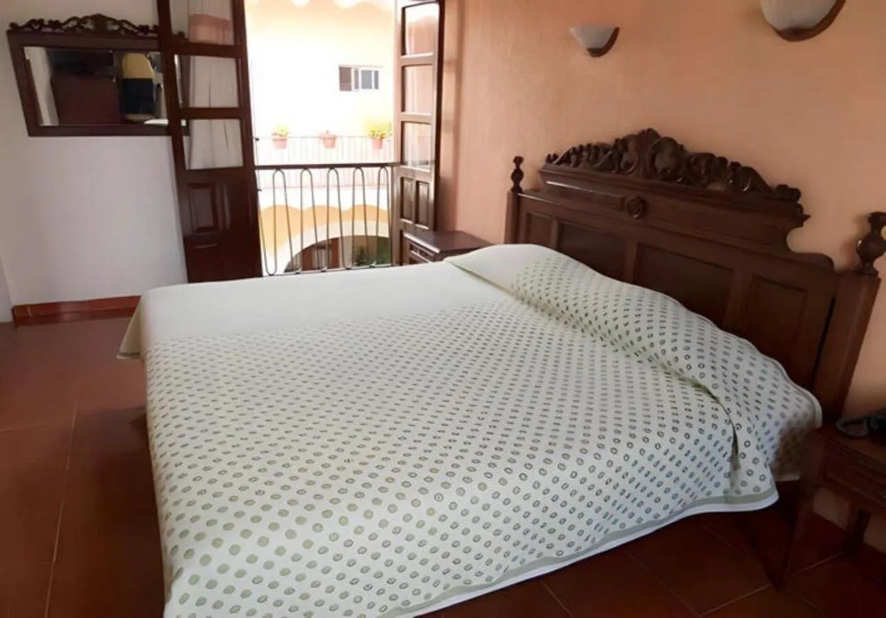 Bed in Hotel Posada Doña Lala