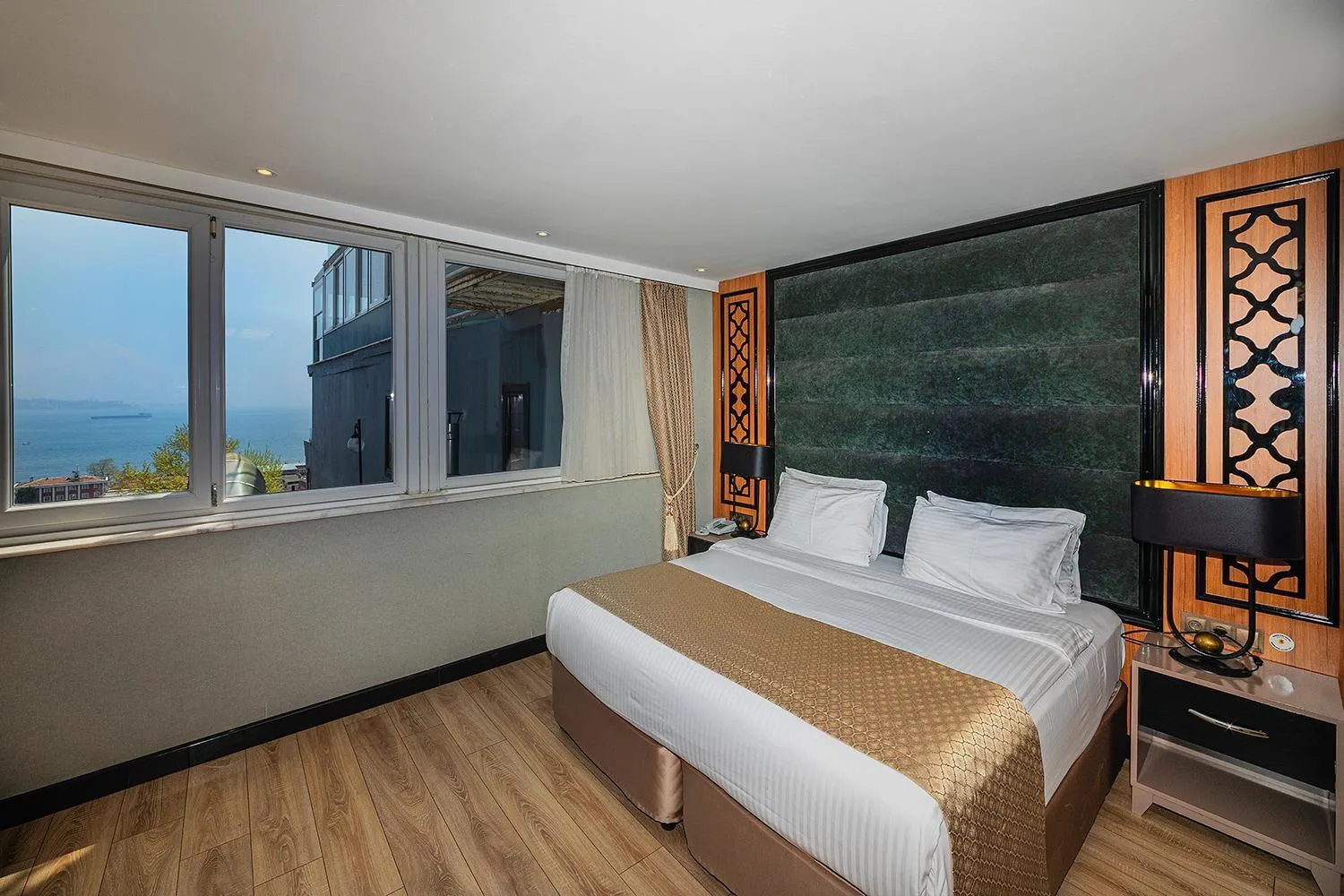 Bed in Aristocrat Hotel