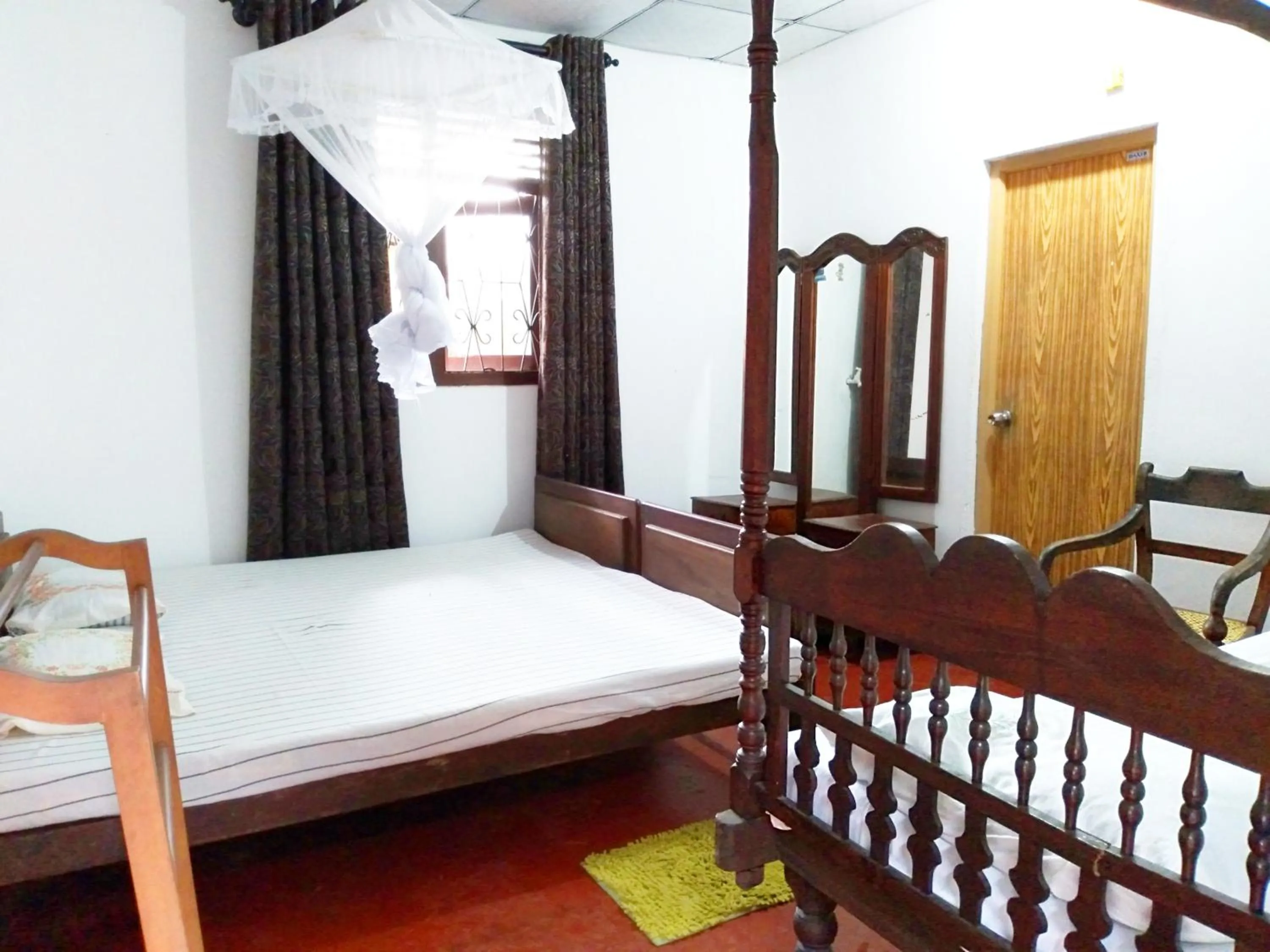 Bed in Green Herbal Ayurvedic Eco-Lodge