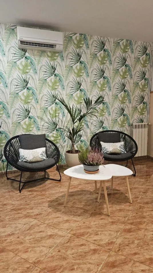 Communal lounge/ TV room in Hostal Rio De Castro