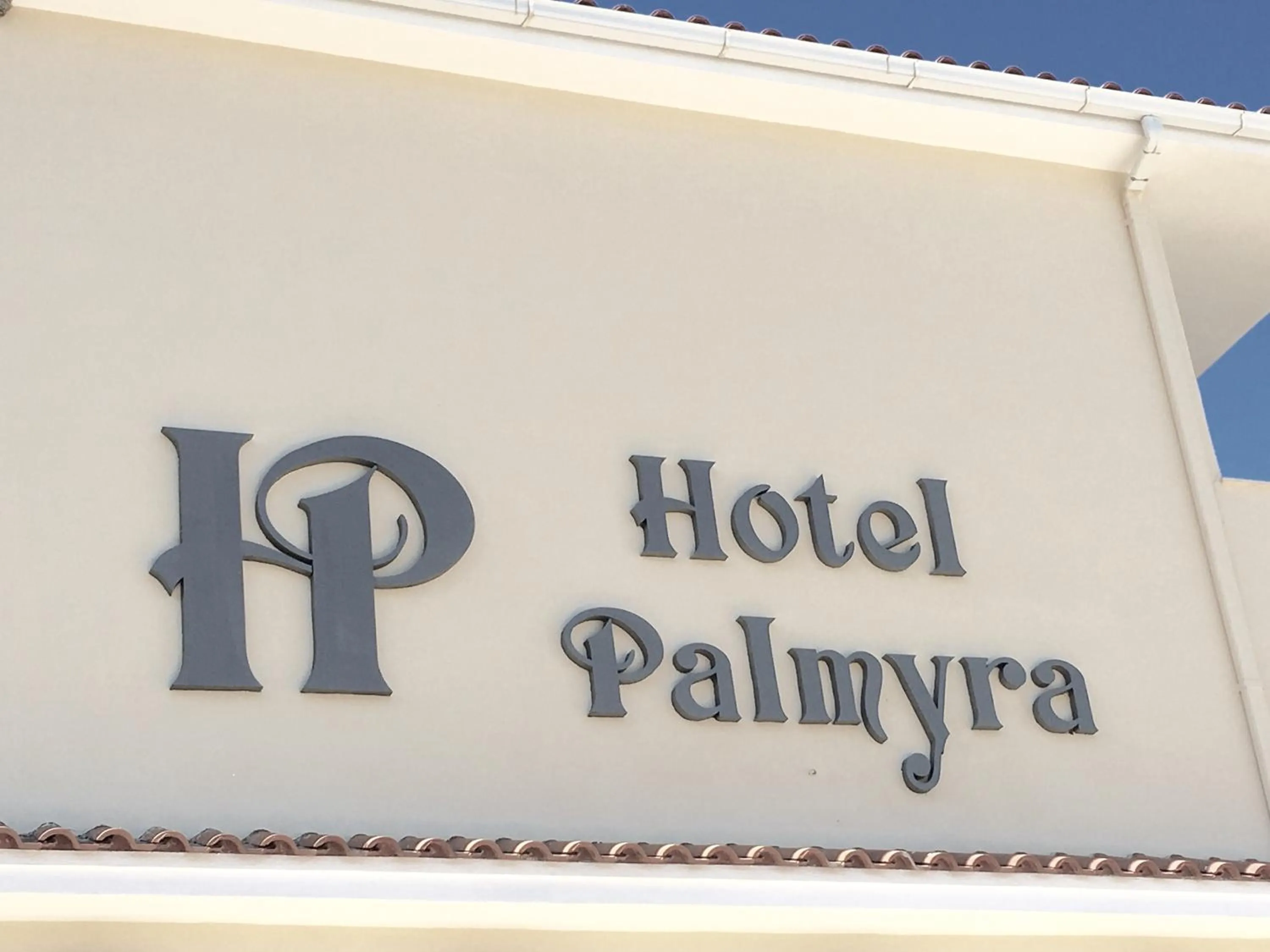 Property logo or sign in Hotel Palmyra