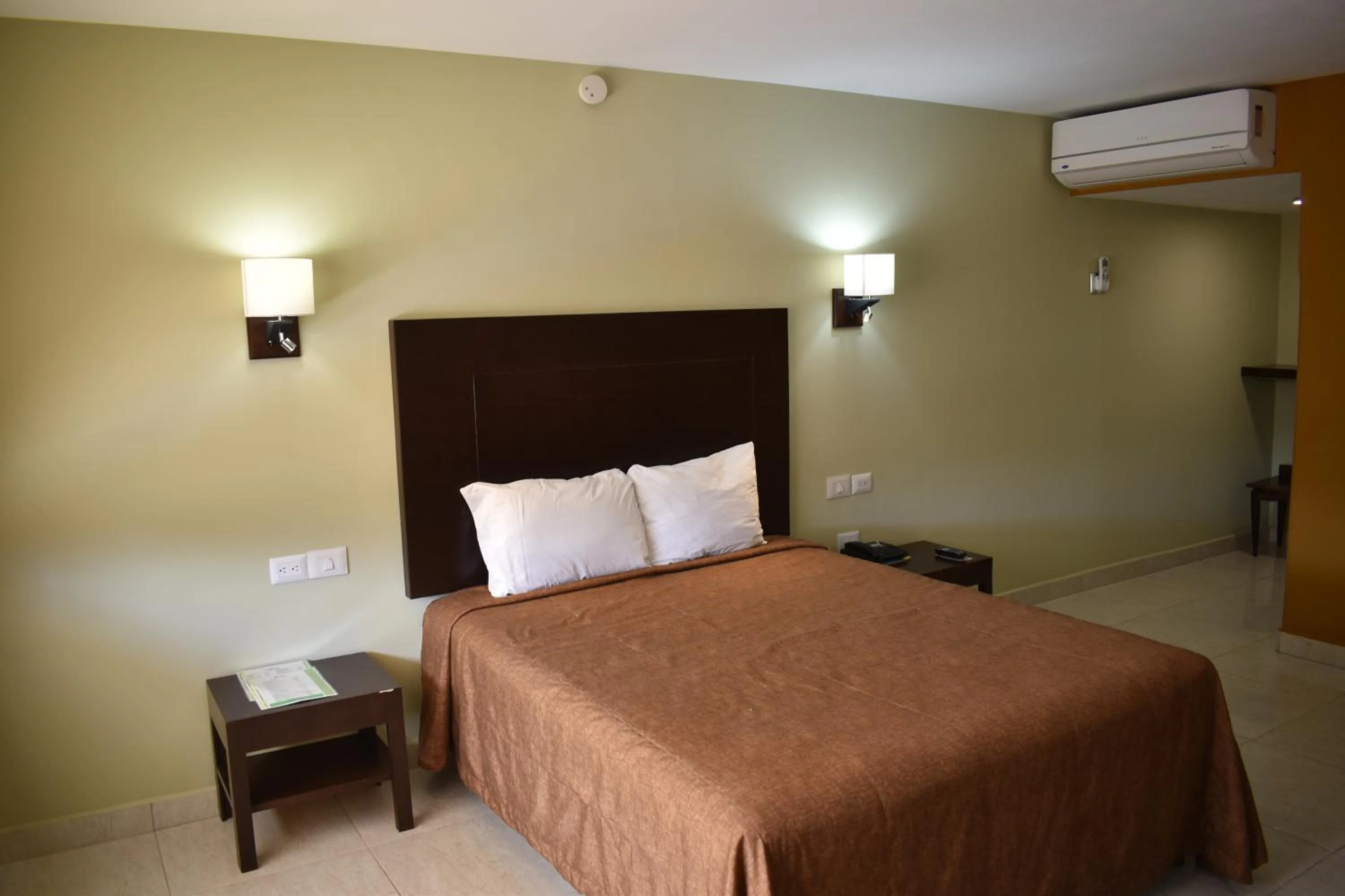 Bedroom in El Camino Hotel & Suites