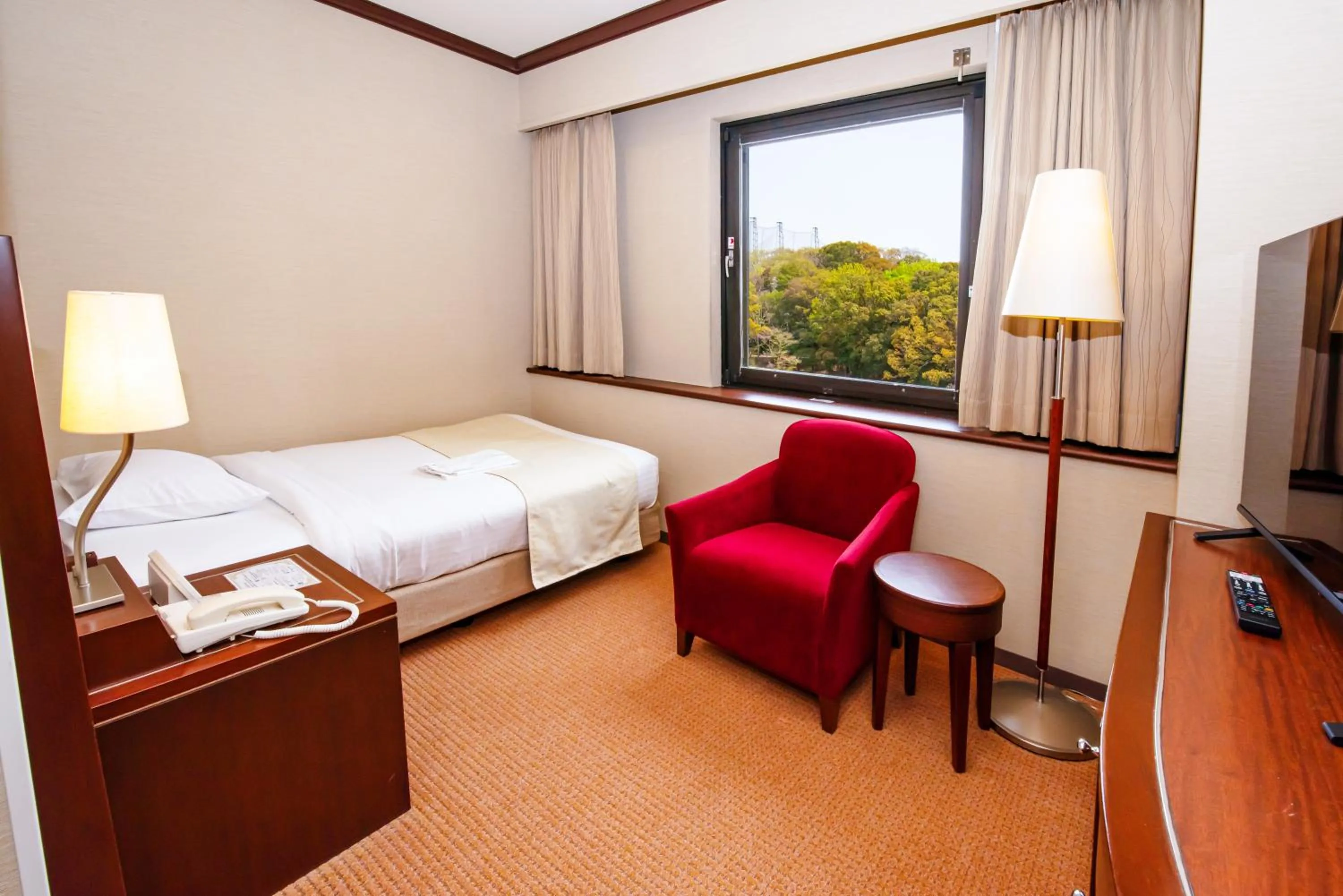 Bed in Okayama International Hotel