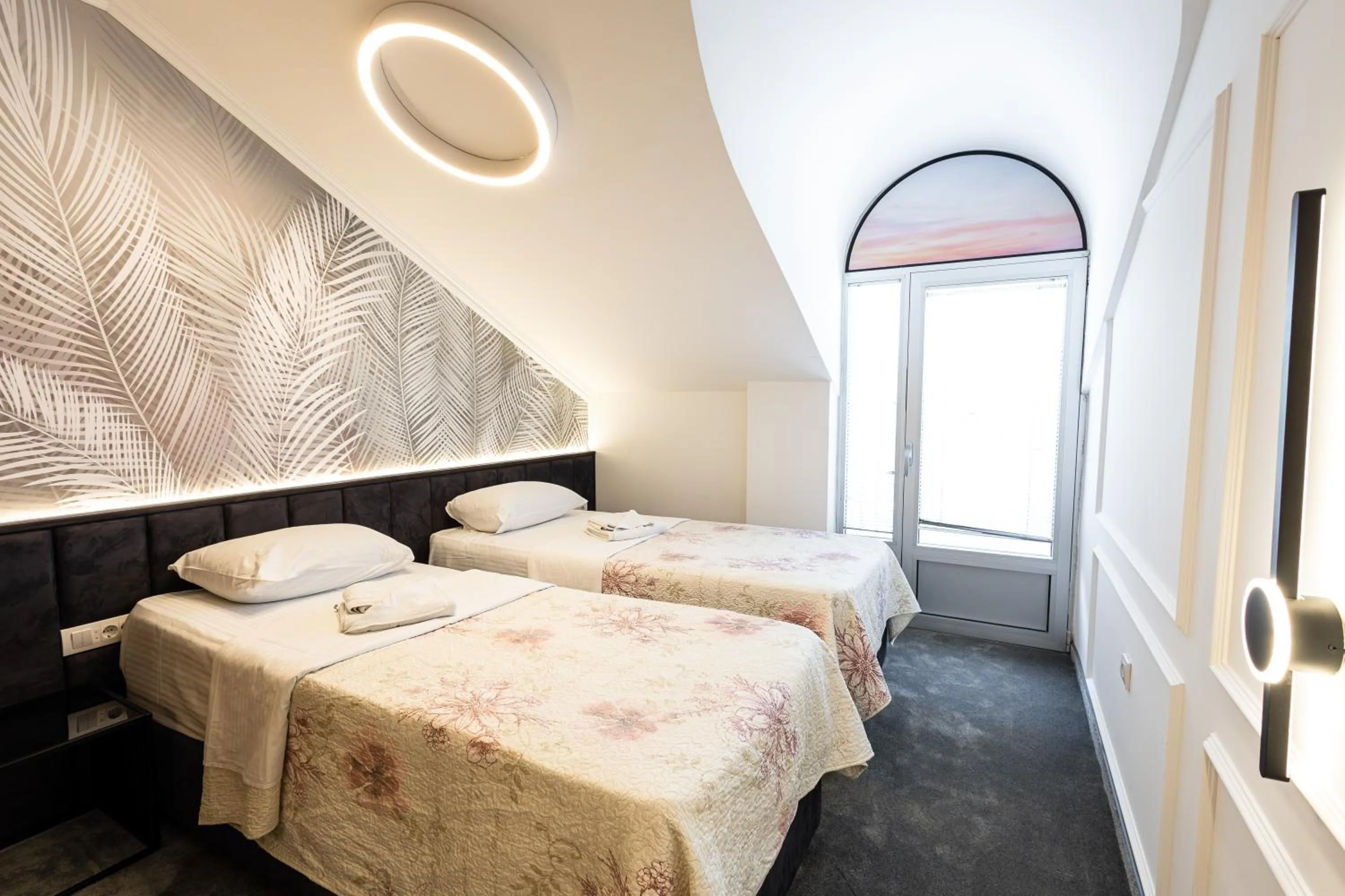 Bed in Garni Hotel Lotos