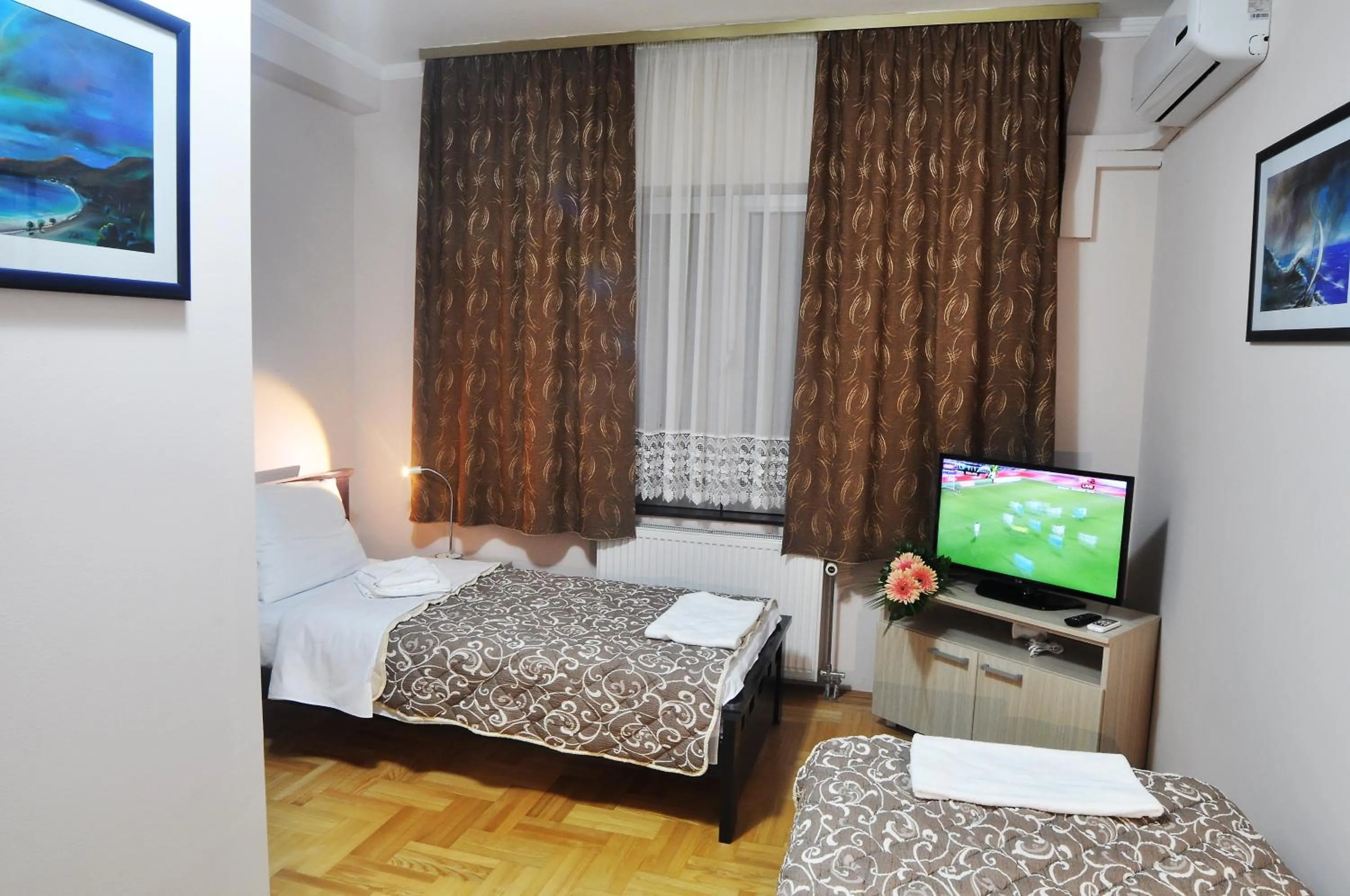 Bed in Garni Hotel Lotos