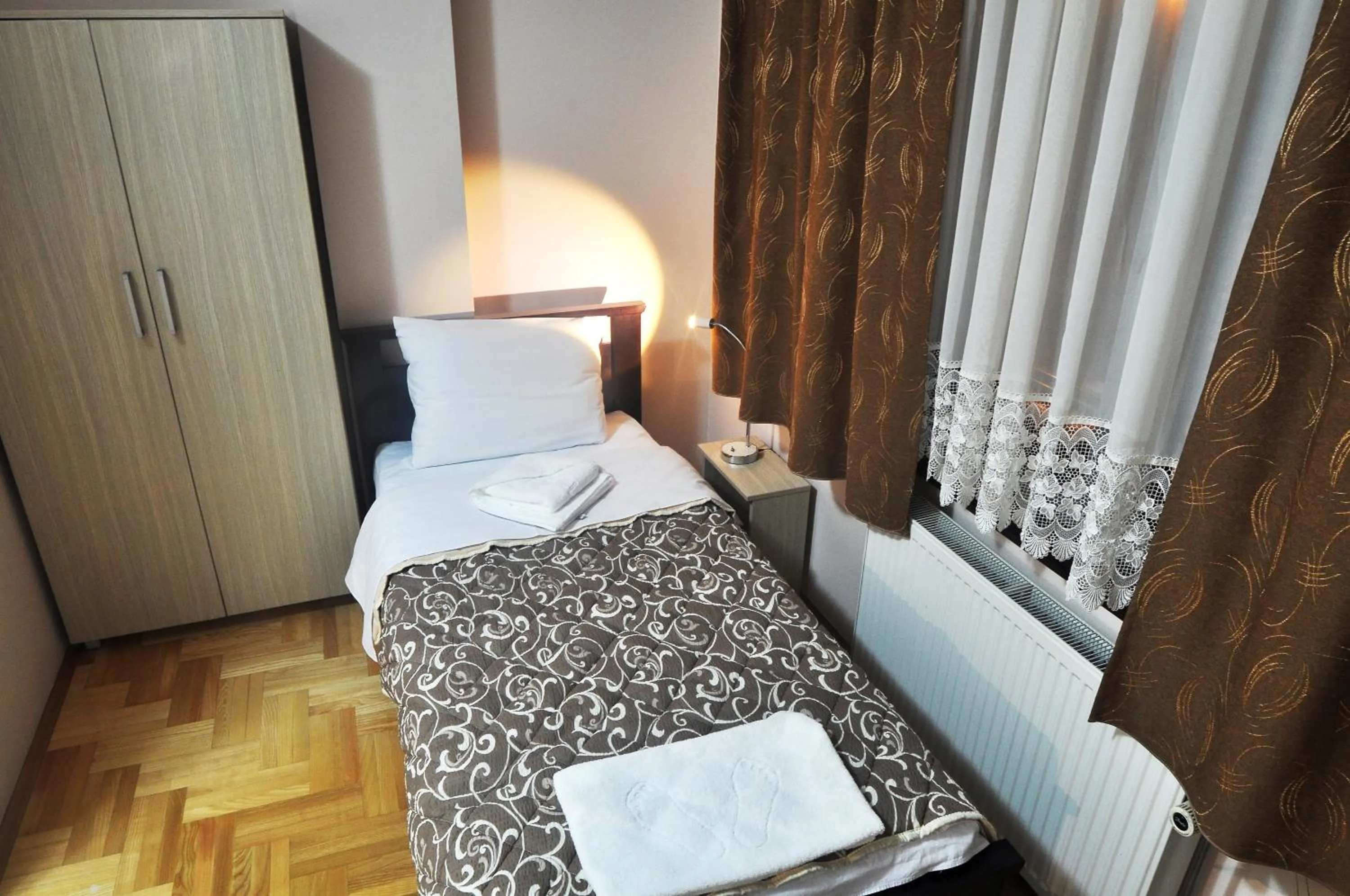 Bed in Garni Hotel Lotos