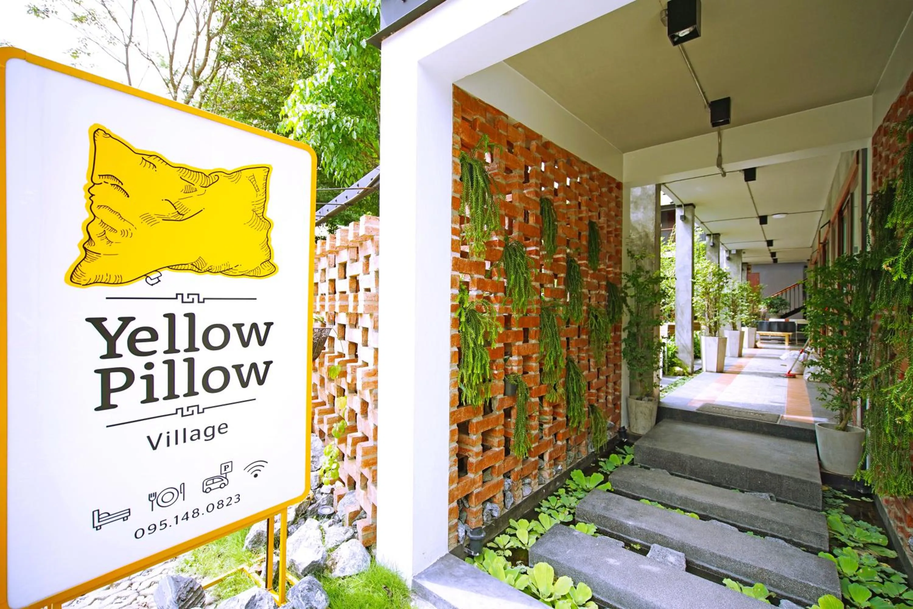 Property logo or sign in Yellow Pillow village