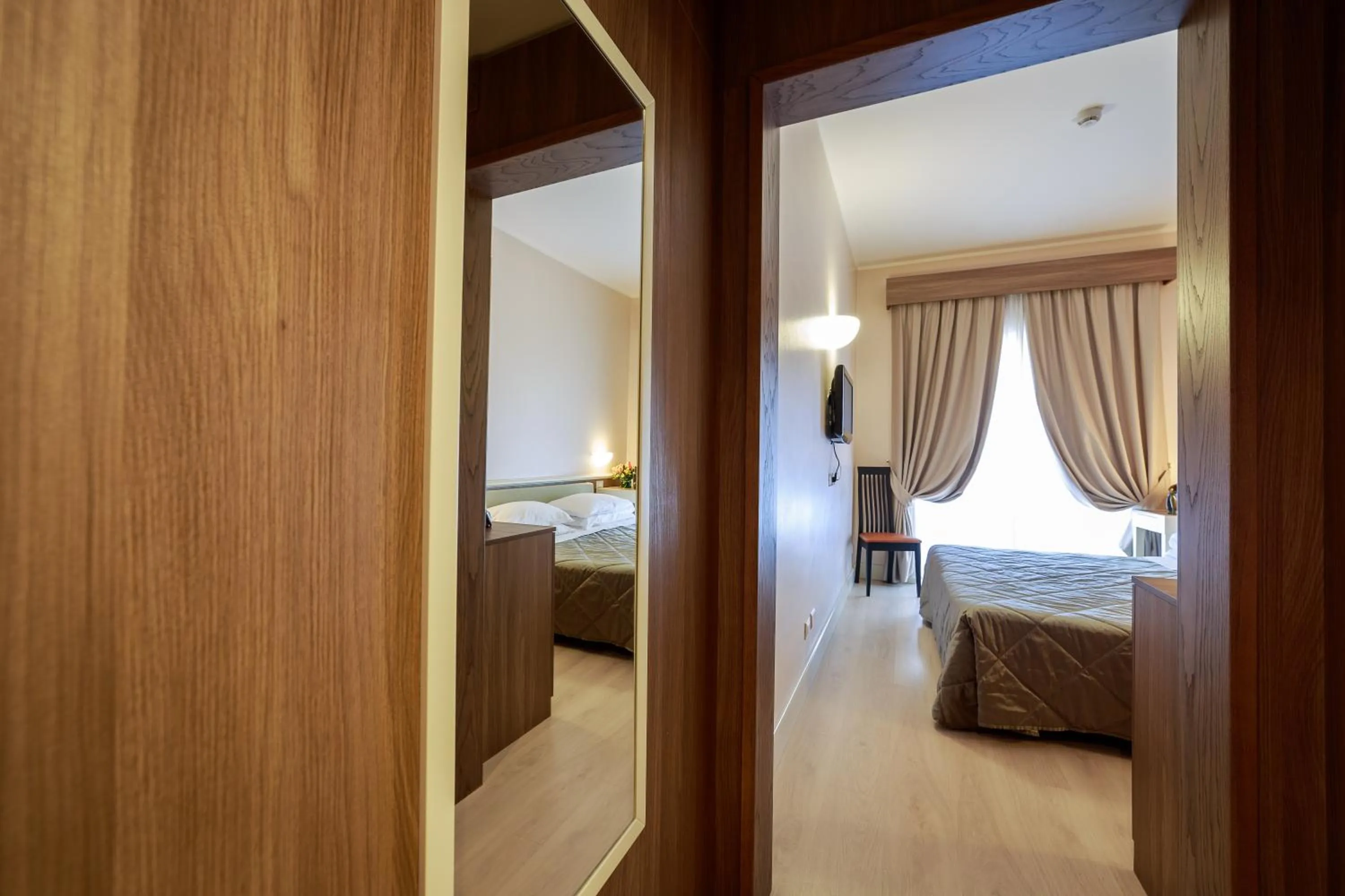 Bed in Hotel Mirasole International