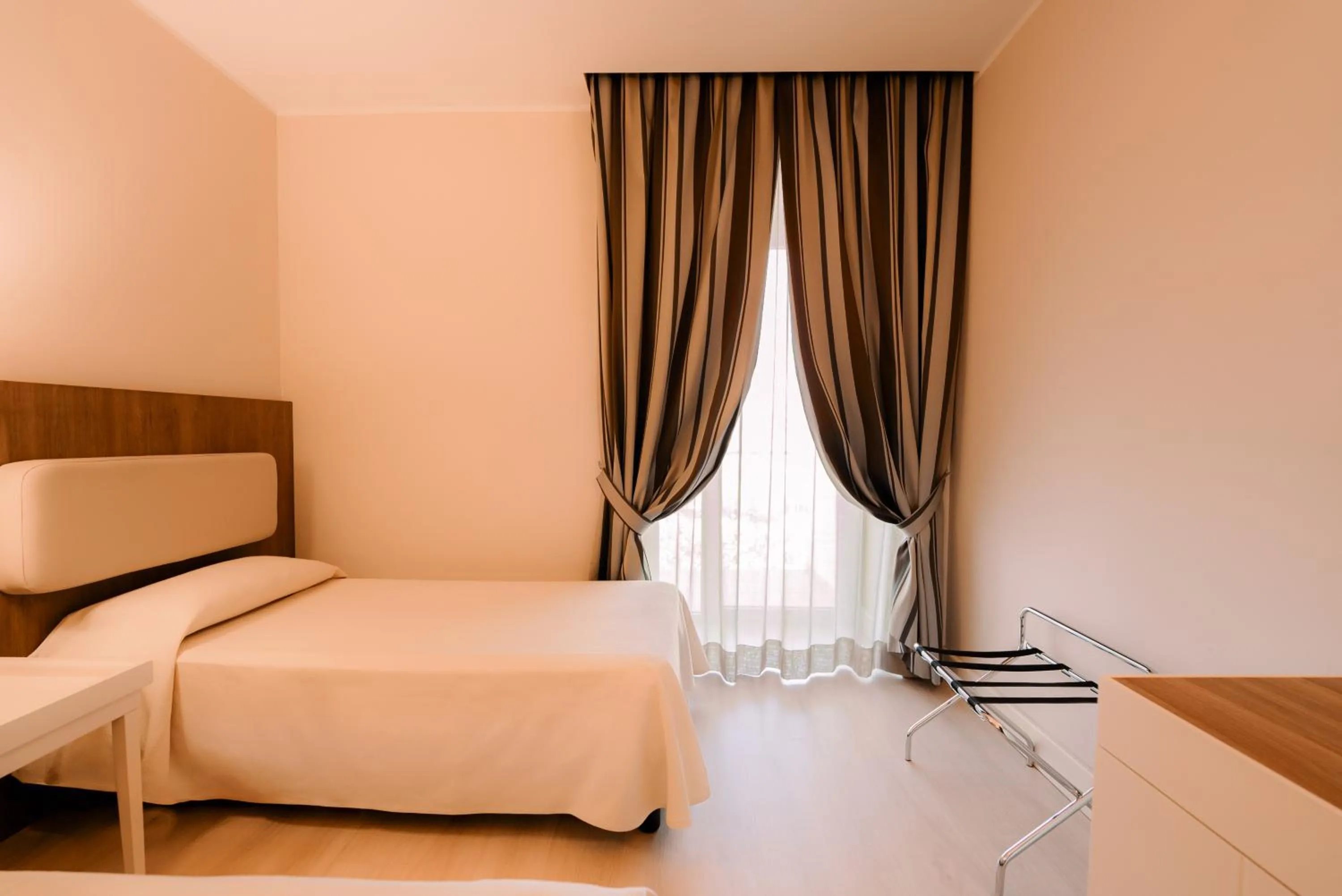 Bed in Hotel Mirasole International