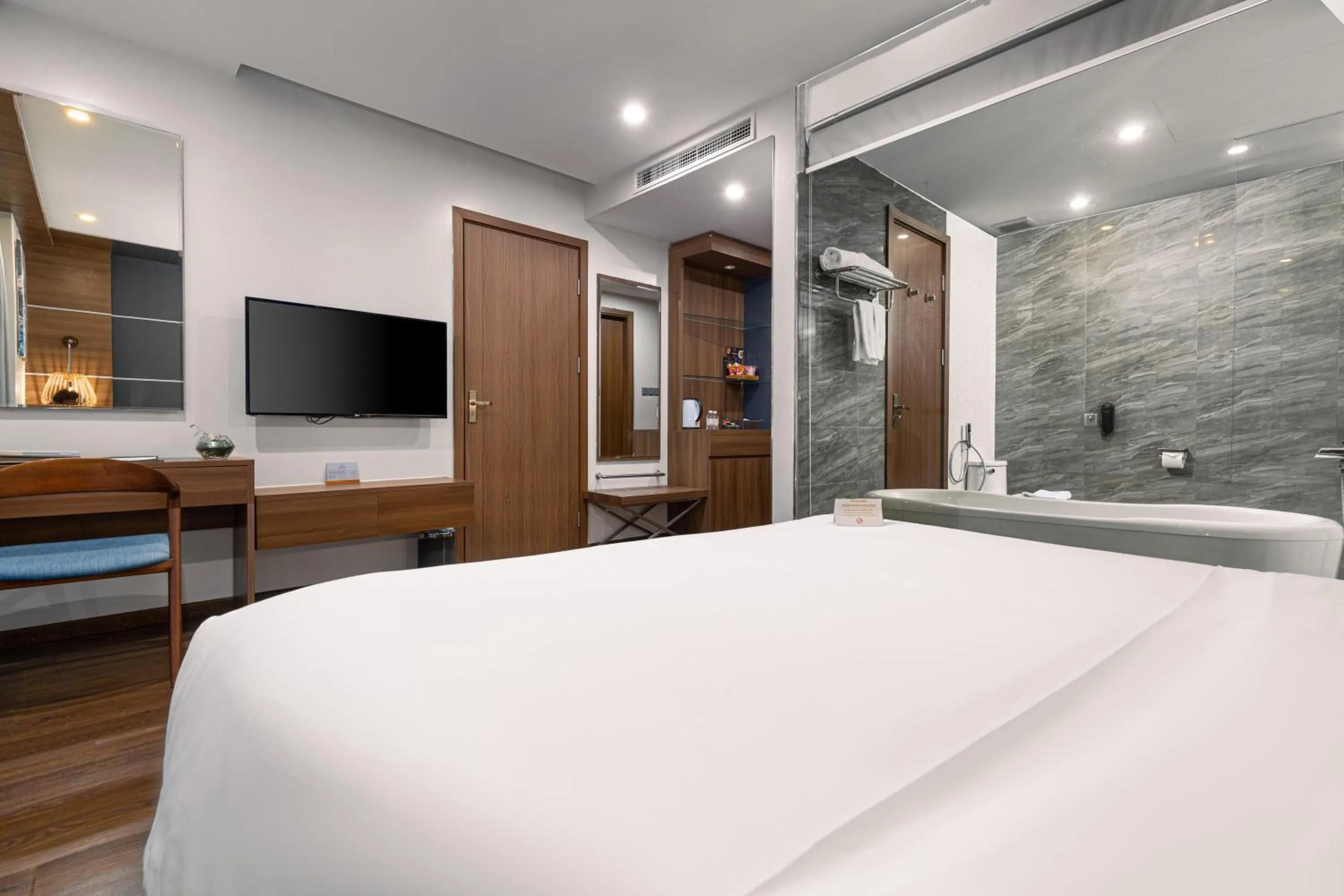 Bed in HAIAN Beach Hotel & Spa