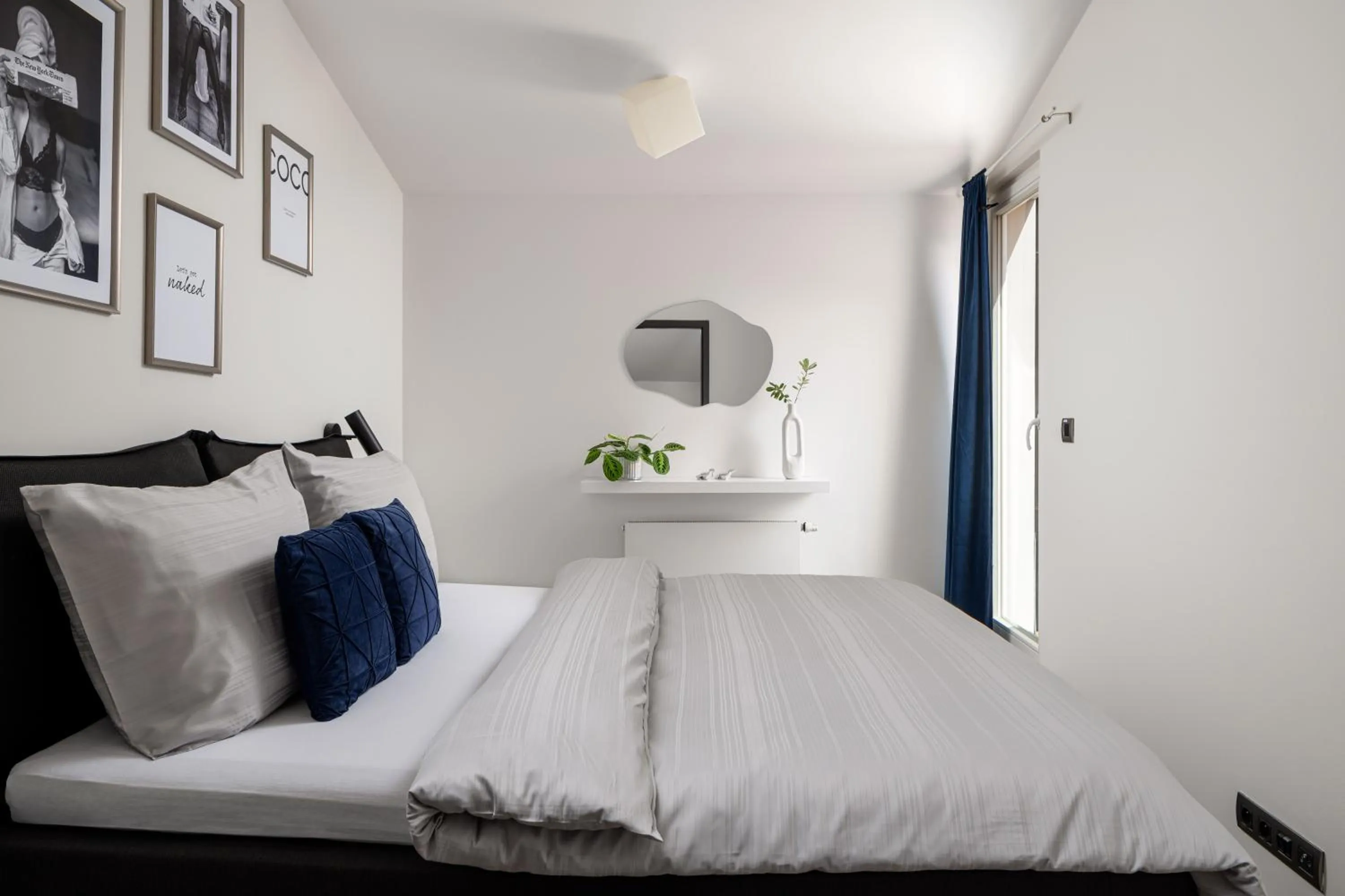 Bed in Coco Chanel Boutique Apartment by Goodnite cz