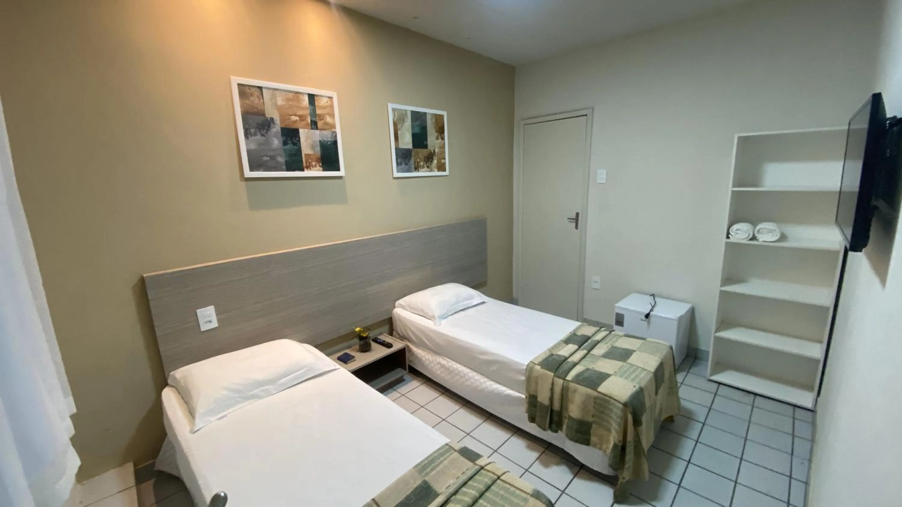 Bed in Center Plaza Hotel