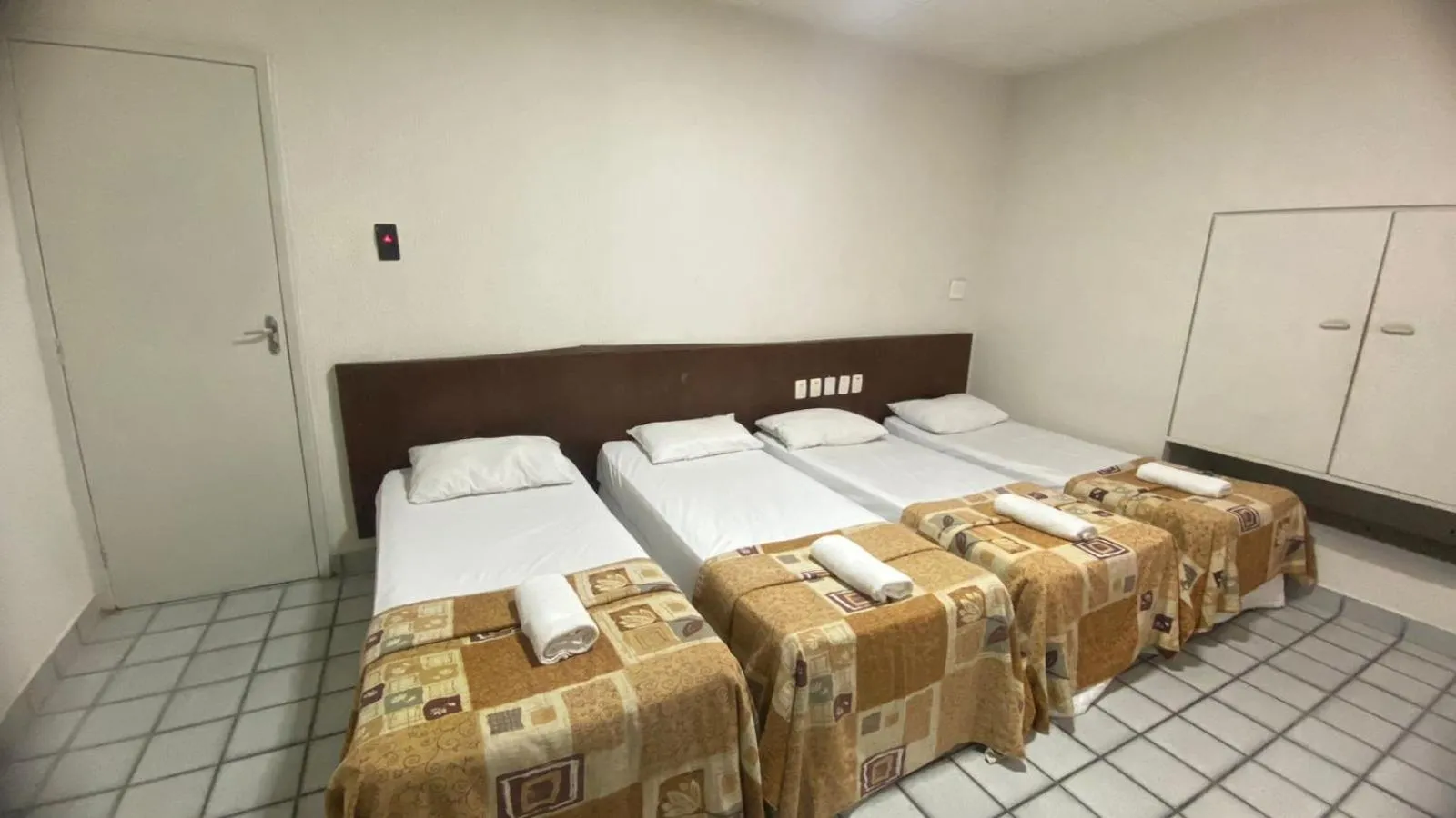 Bed in Center Plaza Hotel