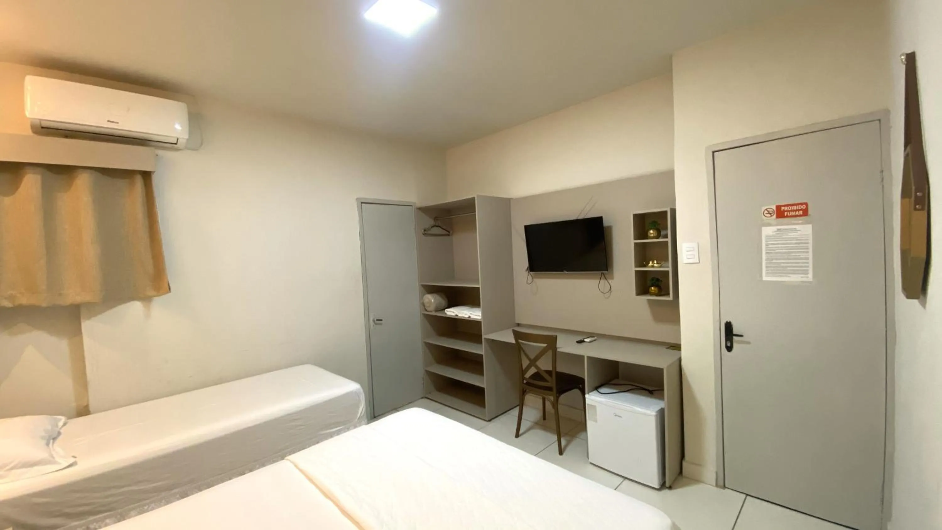 Bed in Center Plaza Hotel