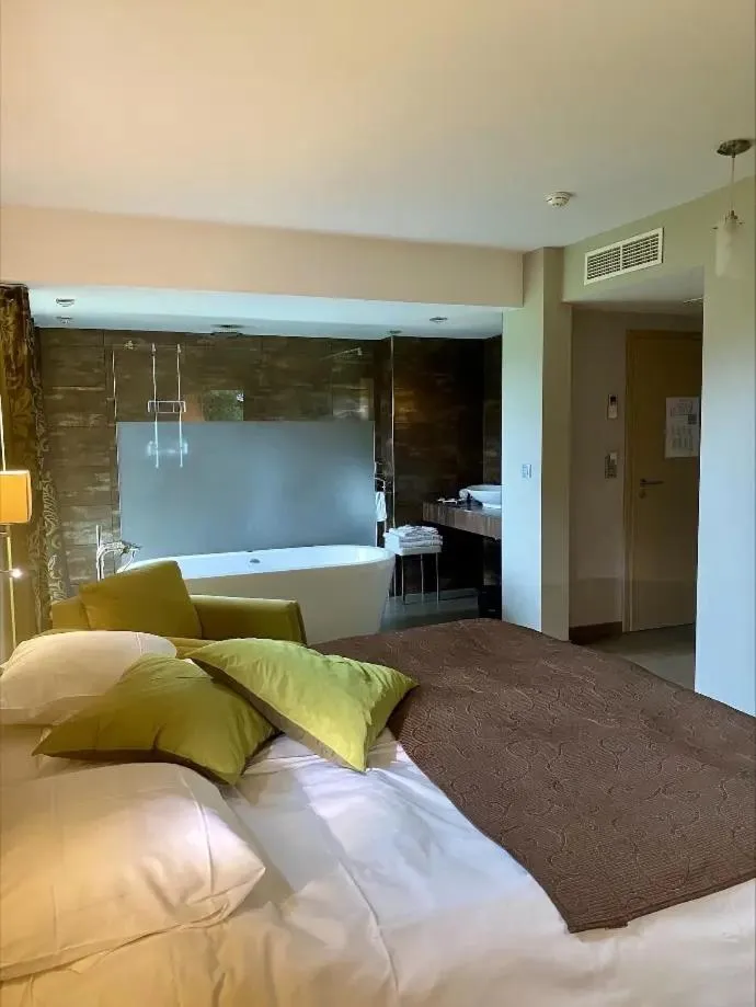 Bed in Hotel L'Ami du Chambertin