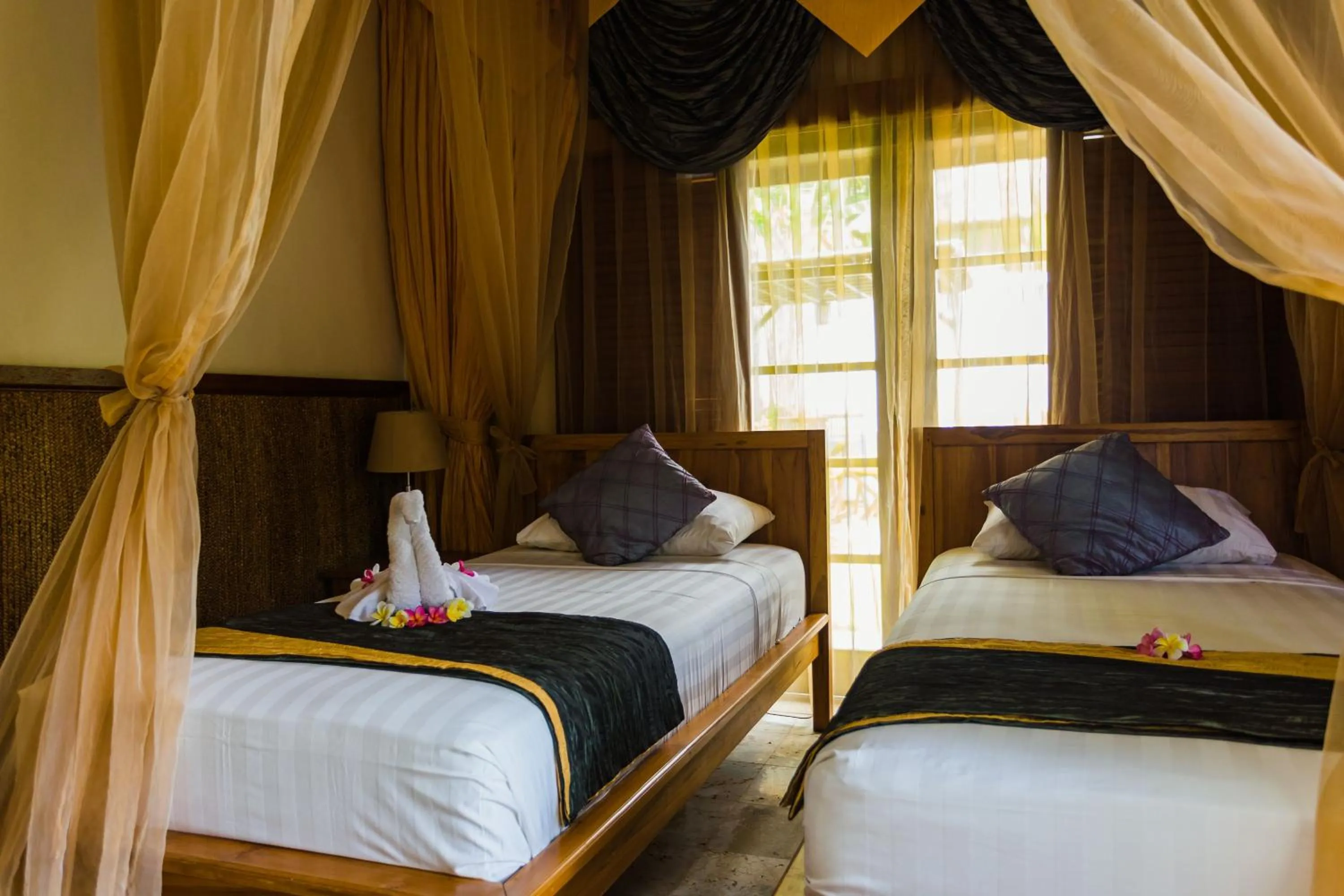 Bed in The Water Garden Hotel