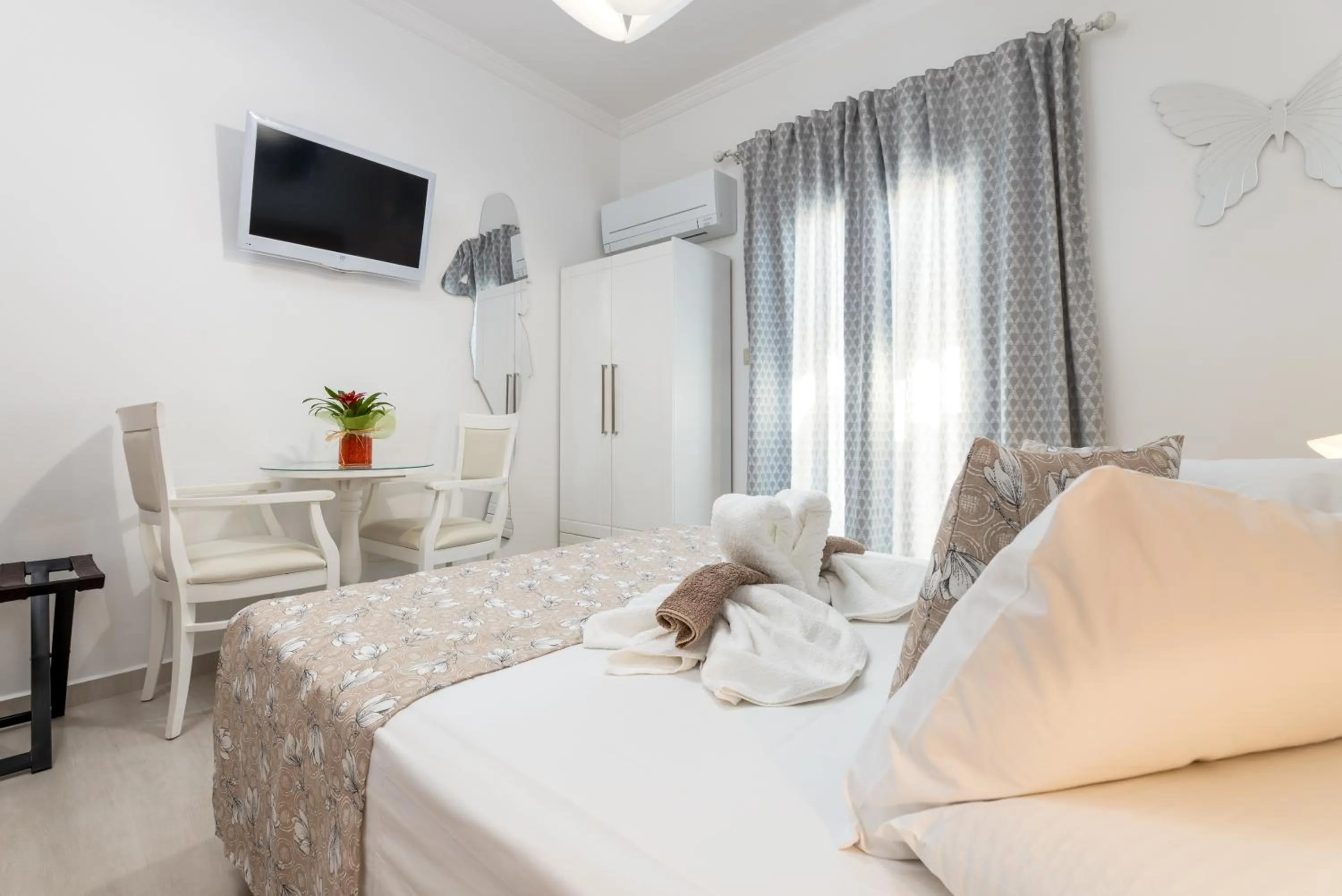 air conditioner, Bed in Panos Luxury Studios